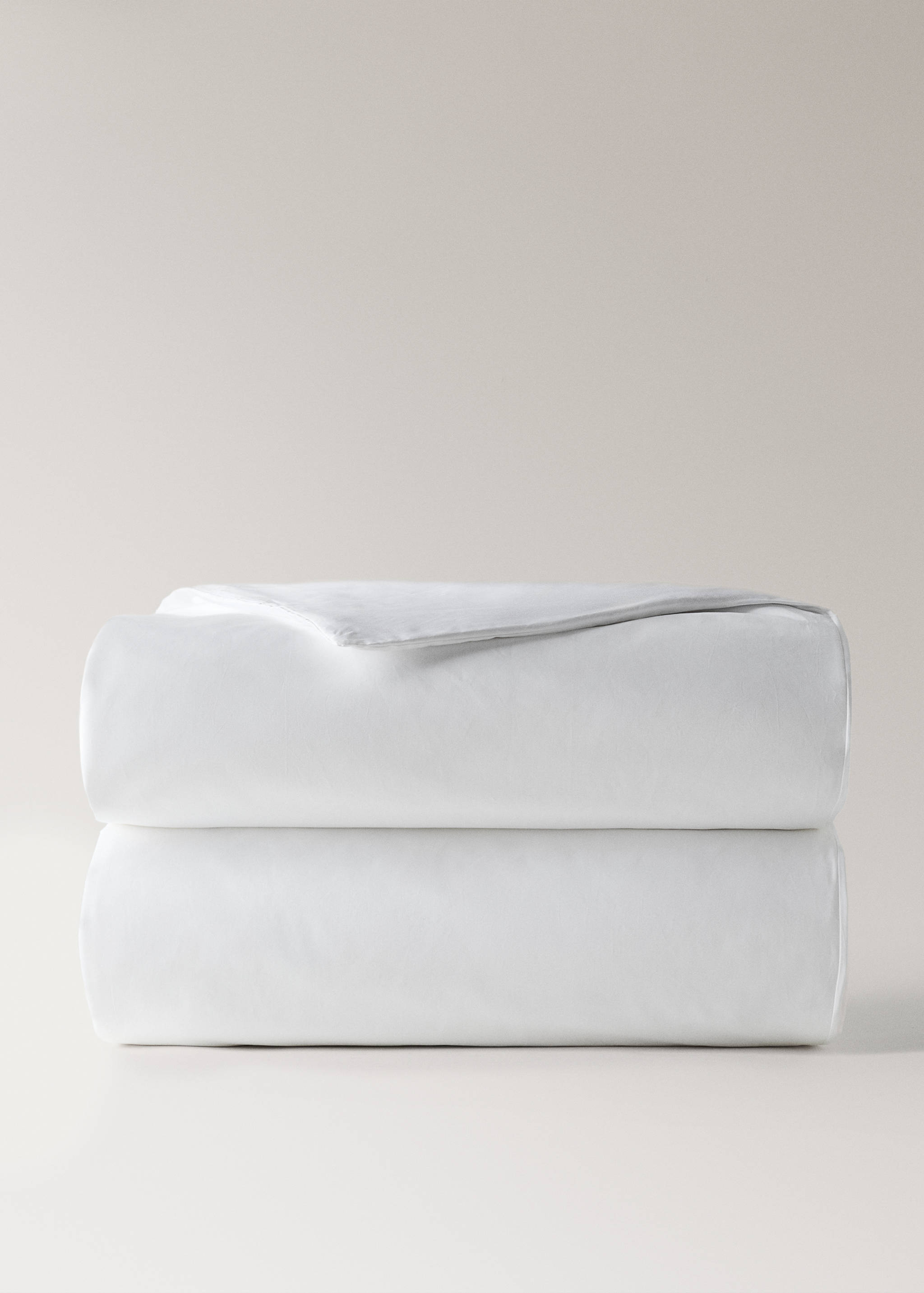 White duvet cover folded neatly in a front studio view.