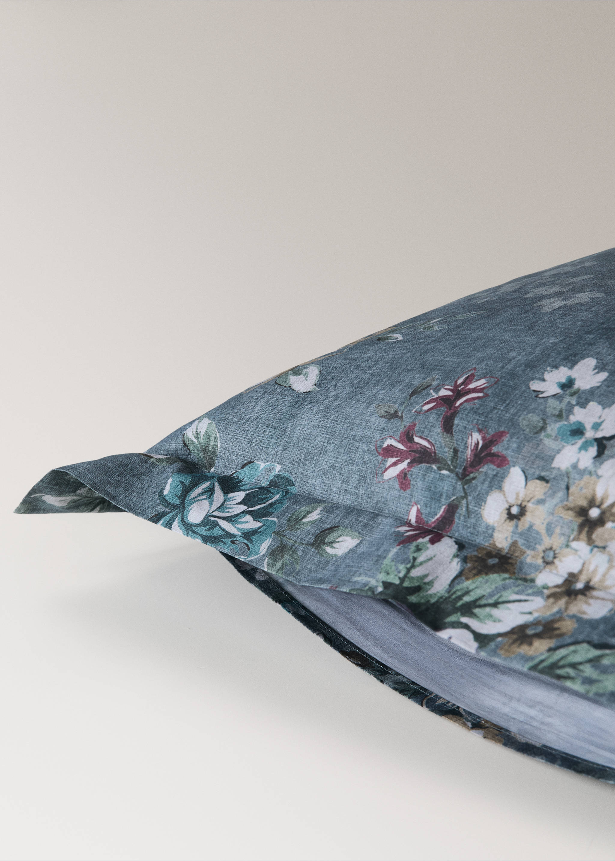 Close-up of a blue-grey floral pillowcase with a decorative border flange., Forest Green. Ref: 37014110-00.