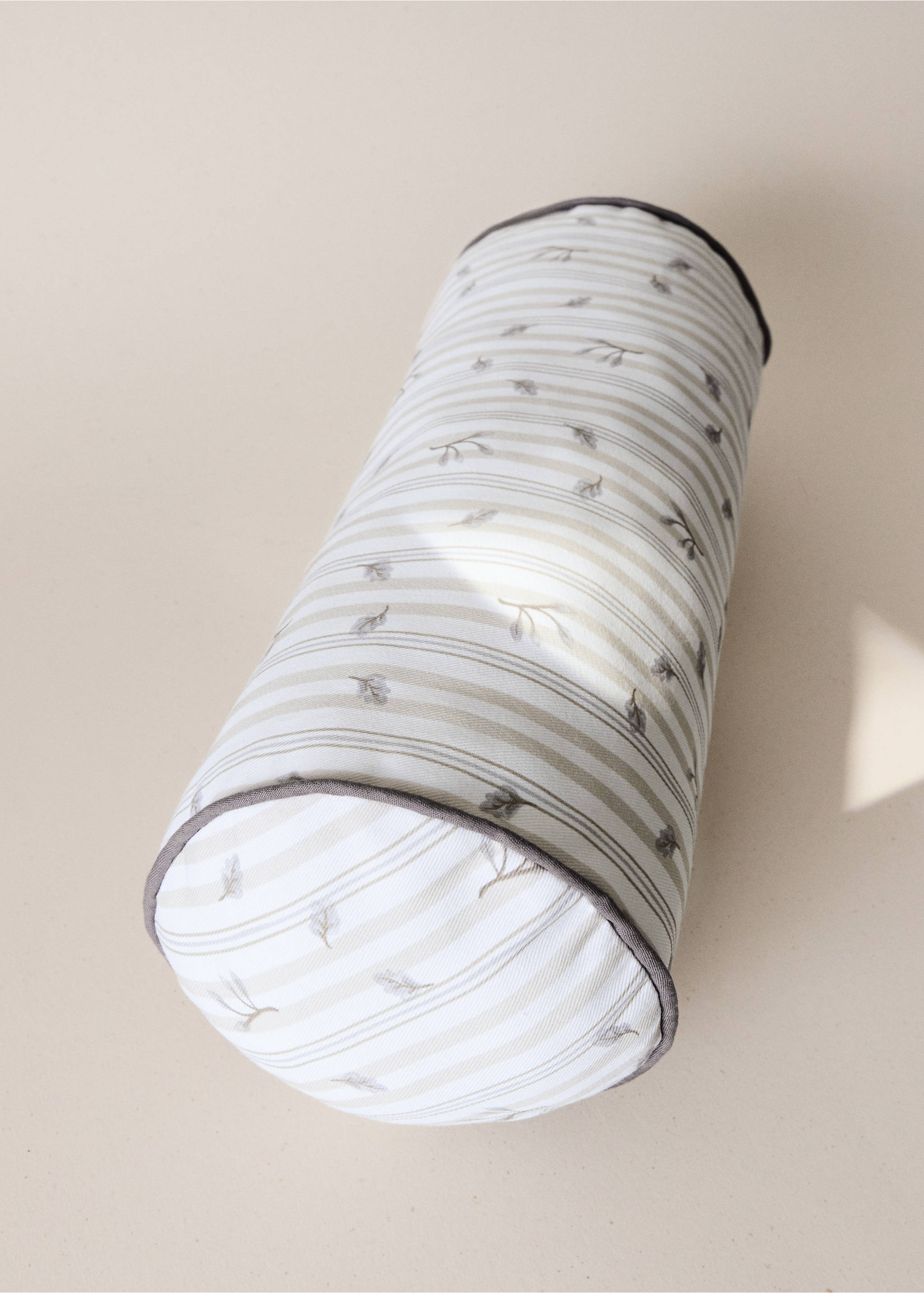 Striped cylindrical cushion cover with a leaf pattern and dark grey piping., Sand. Ref: 37014465-00.