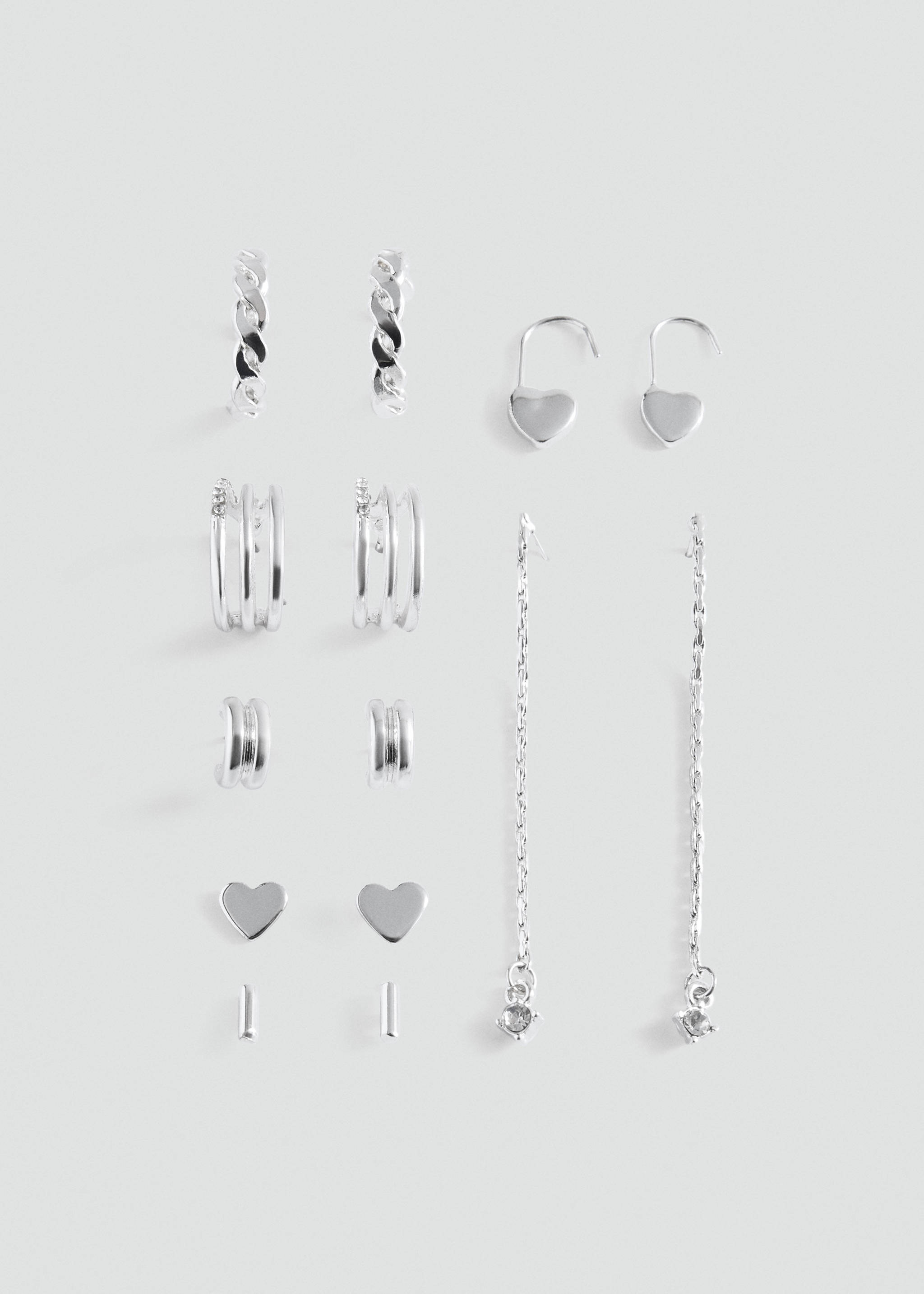 Set of six silver-toned earrings including hoops, hearts, and long chain drops.