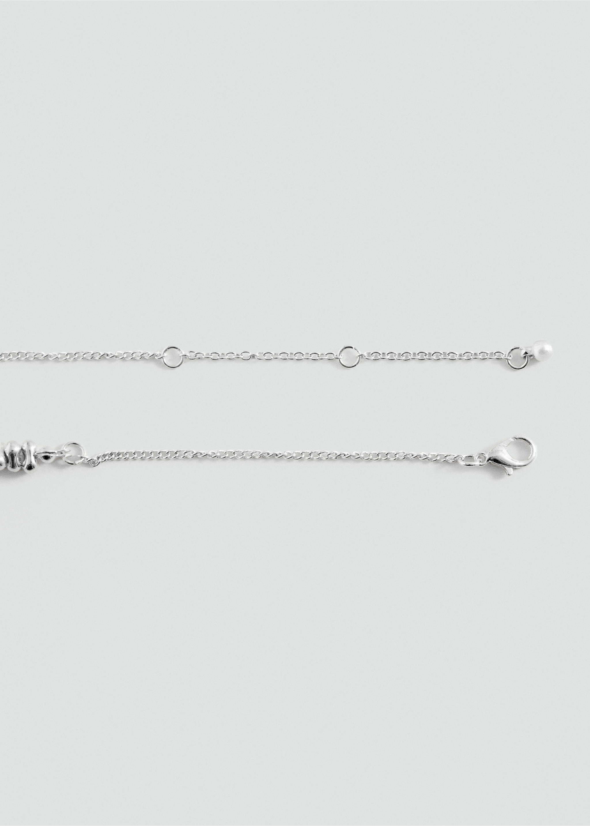 Silver-toned metal collar necklace detail showing adjustable chain closure., Silver. Ref: 37015196-00.