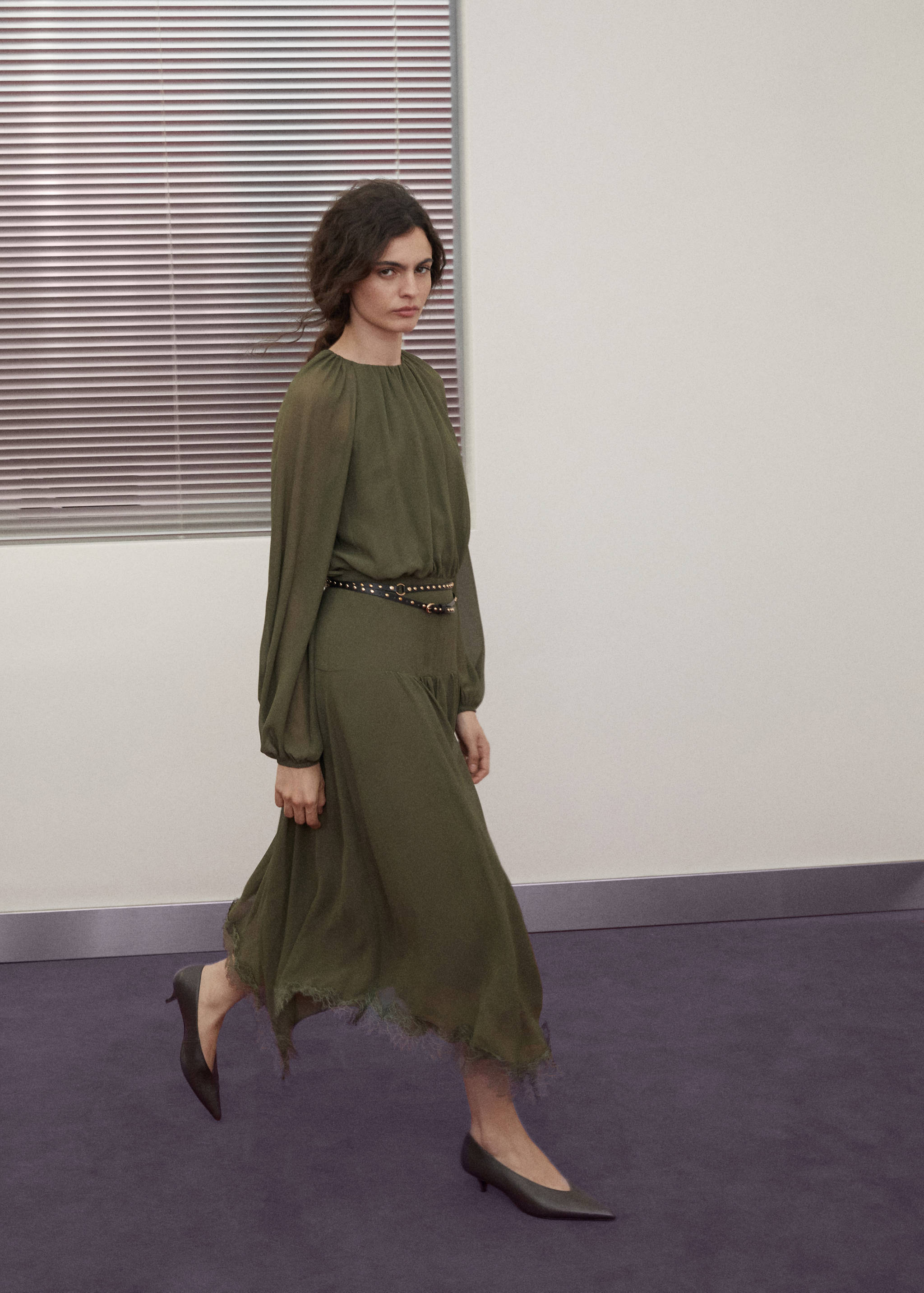 Olive green midi dress with long sleeves, drop-waist silhouette, and lace-trimmed handkerchief hem.
