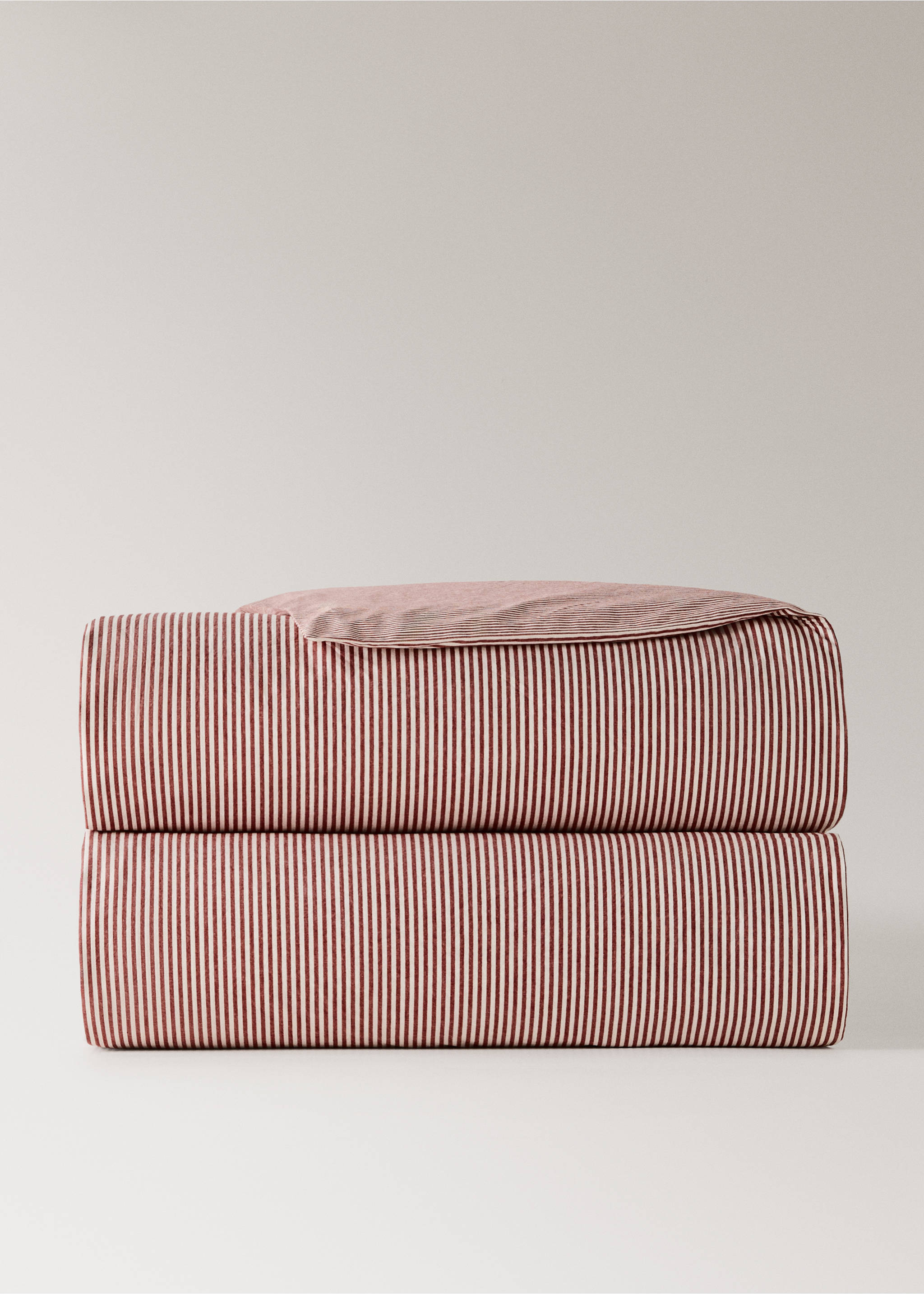 Red and white striped duvet cover folded in a neat stack., Red. Ref: 37016334-00.