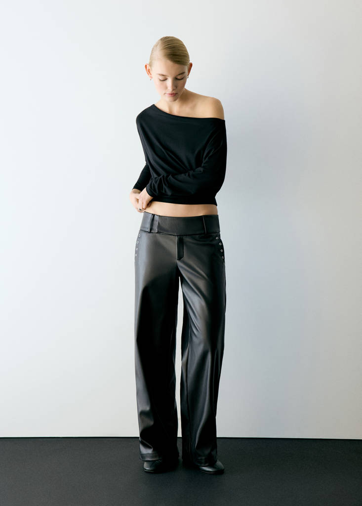 Leather-effect trousers with eyelets — Black