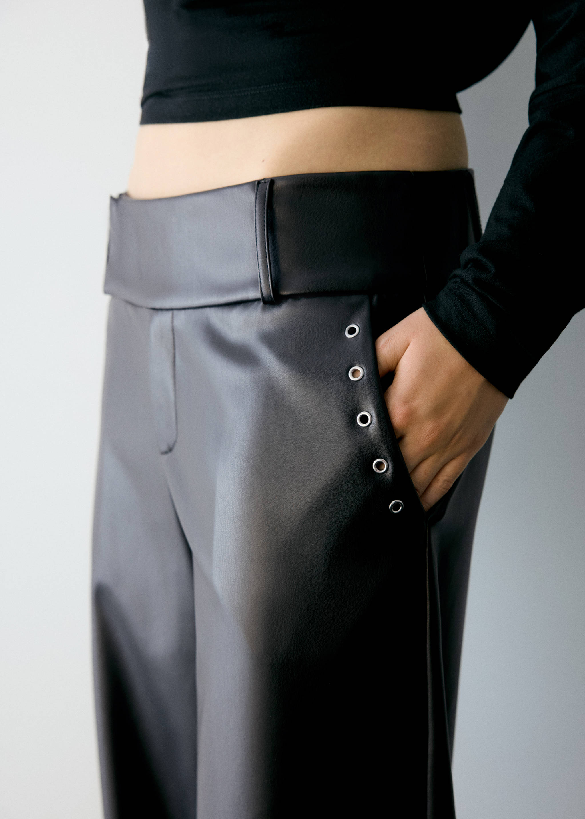 Leather-effect trousers with eyelets - Details of the article 3
