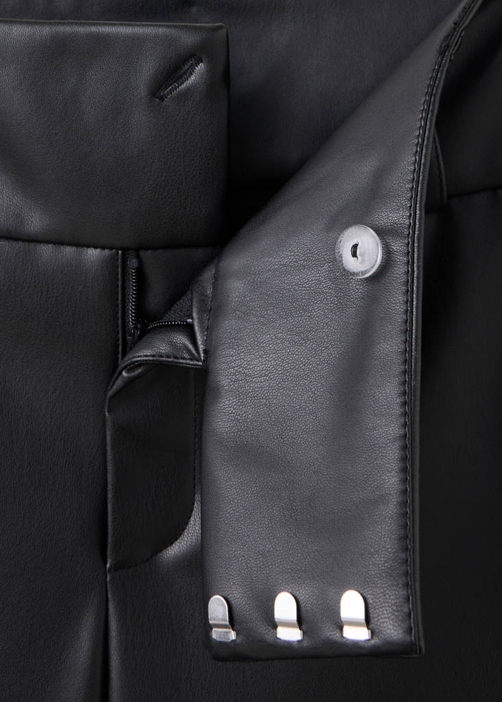 Leather-effect trousers with eyelets — Black