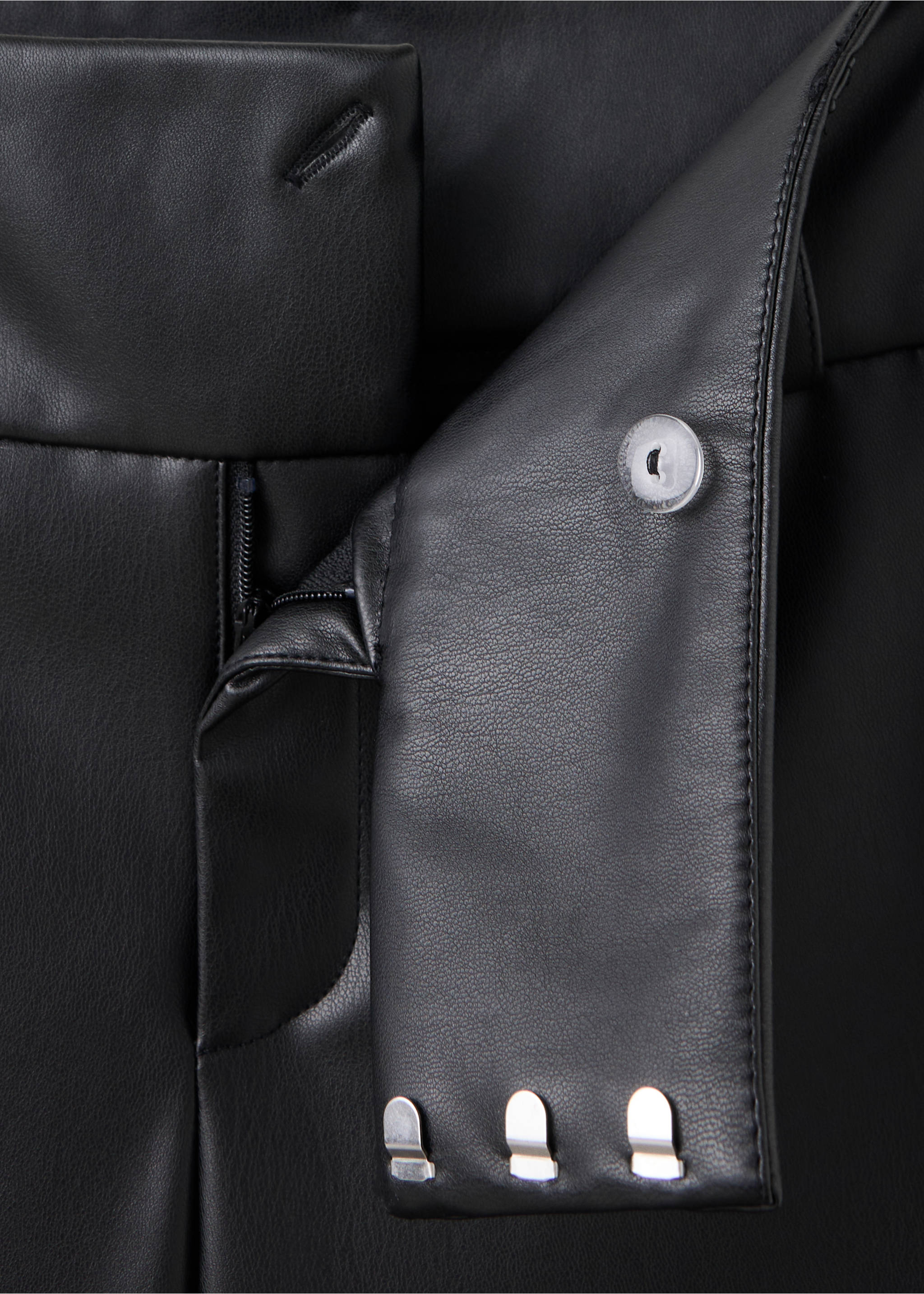 Leather-effect trousers with eyelets - Details of the article 8, Black. Ref: 37016344-00.