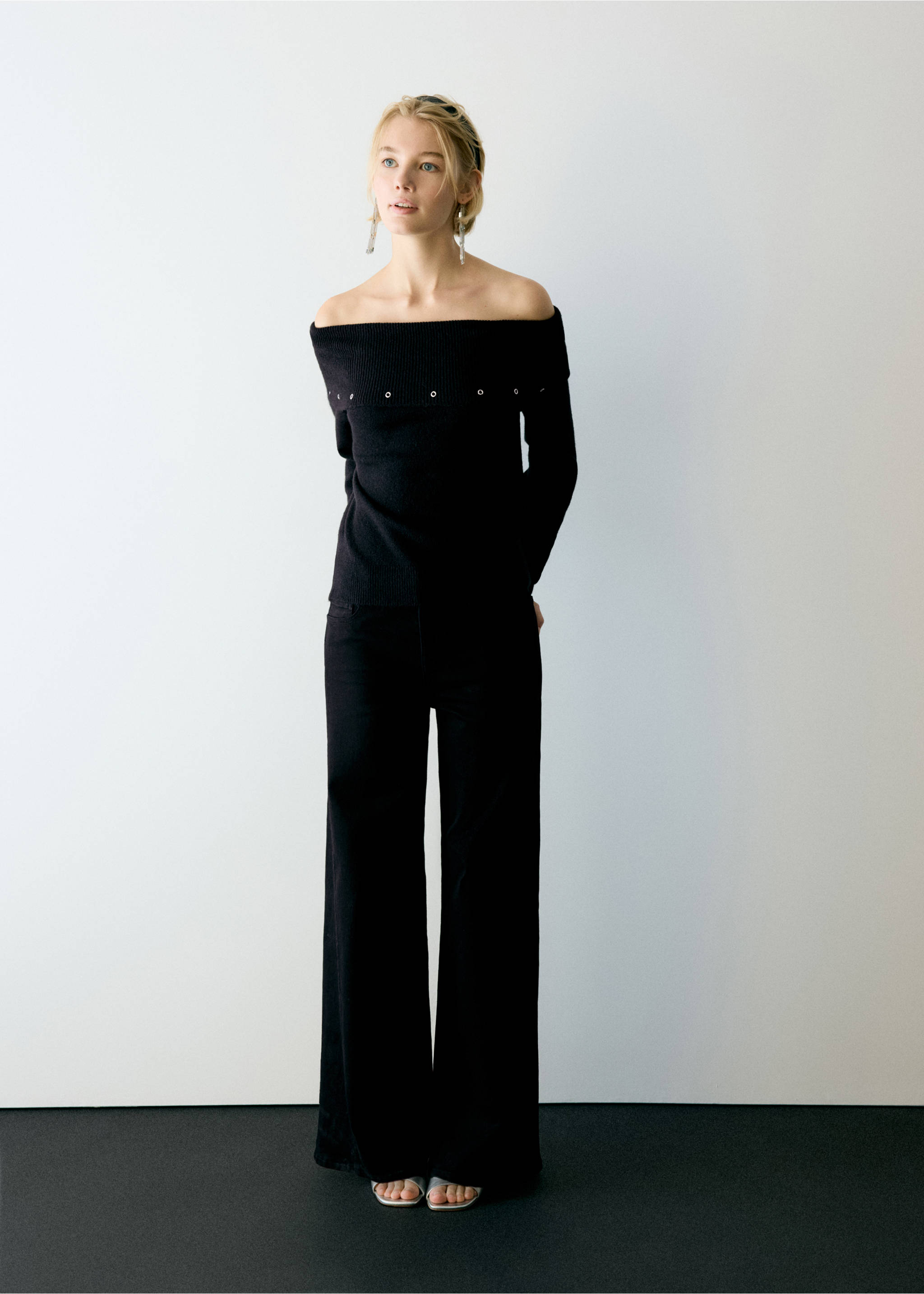 Black denim trousers worn with a matching off-the-shoulder ribbed top with eyelets., Black denim. Ref: 37016350-01.