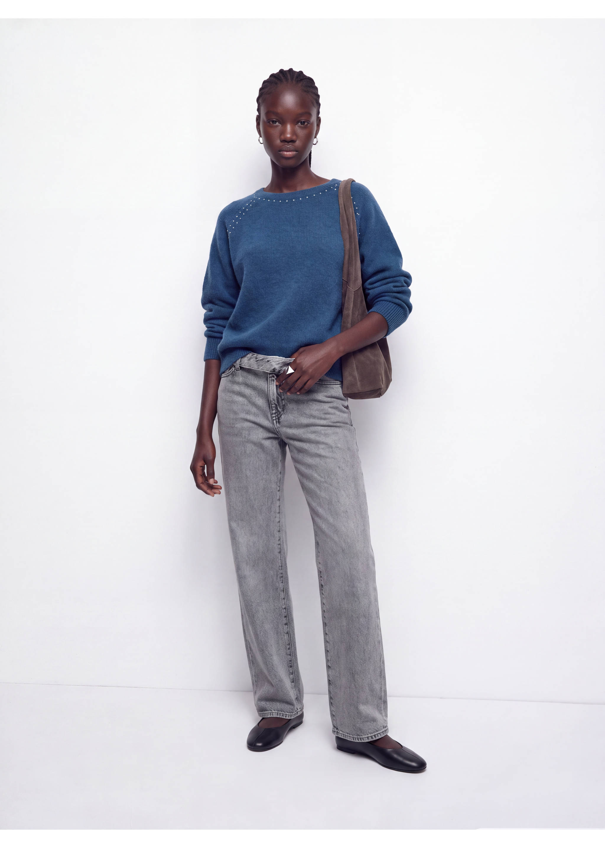 Blue knitted jersey with rhinestone shoulders, worn with grey straight-leg trousers and a brown suede bag., Petrol Blue. Ref: 37016357-00.