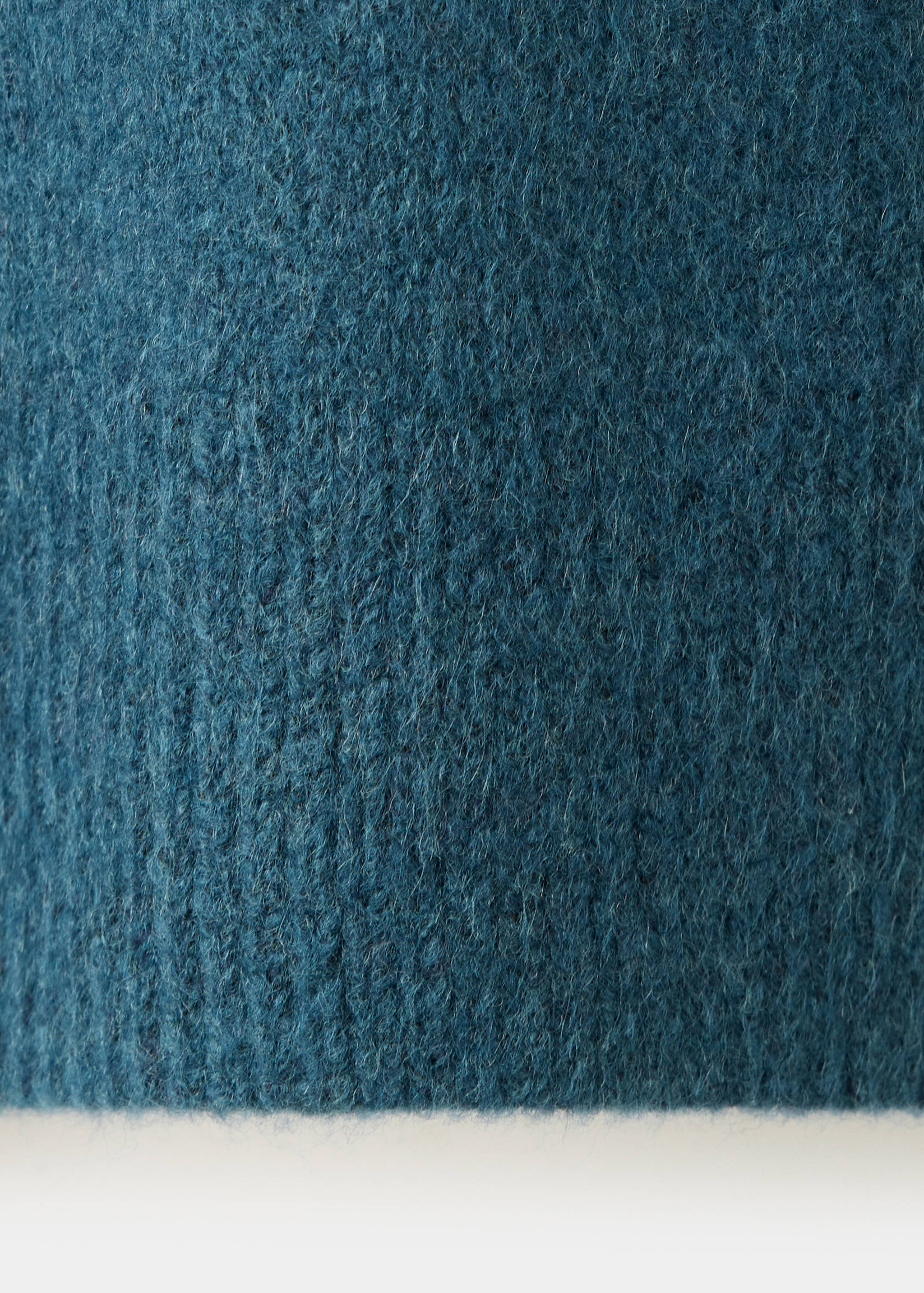 Close-up of the soft, textured blue jersey fabric.