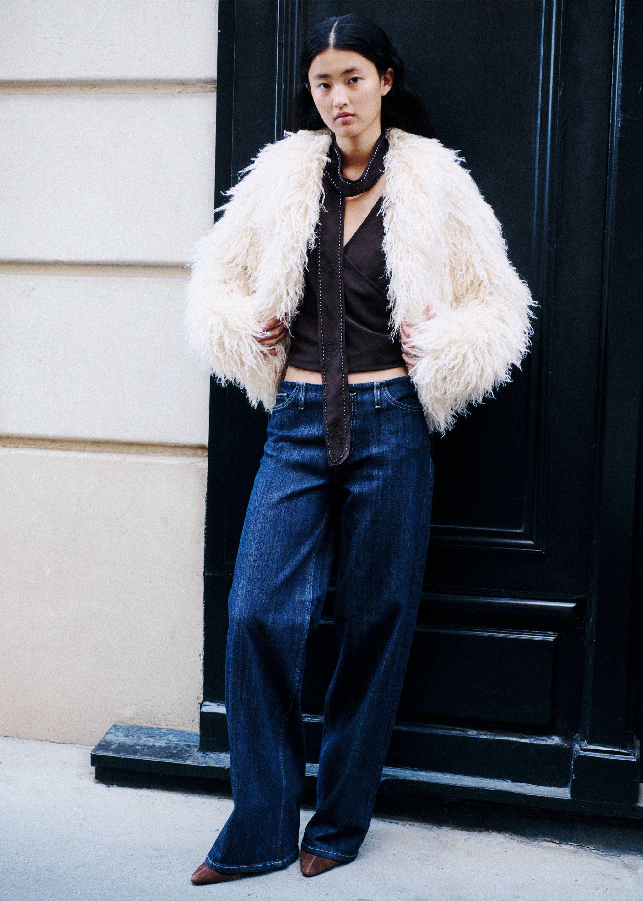 Cream textured faux-fur coat worn with a dark brown top and blue trousers., Ivory White. Ref: 37016742-01.
