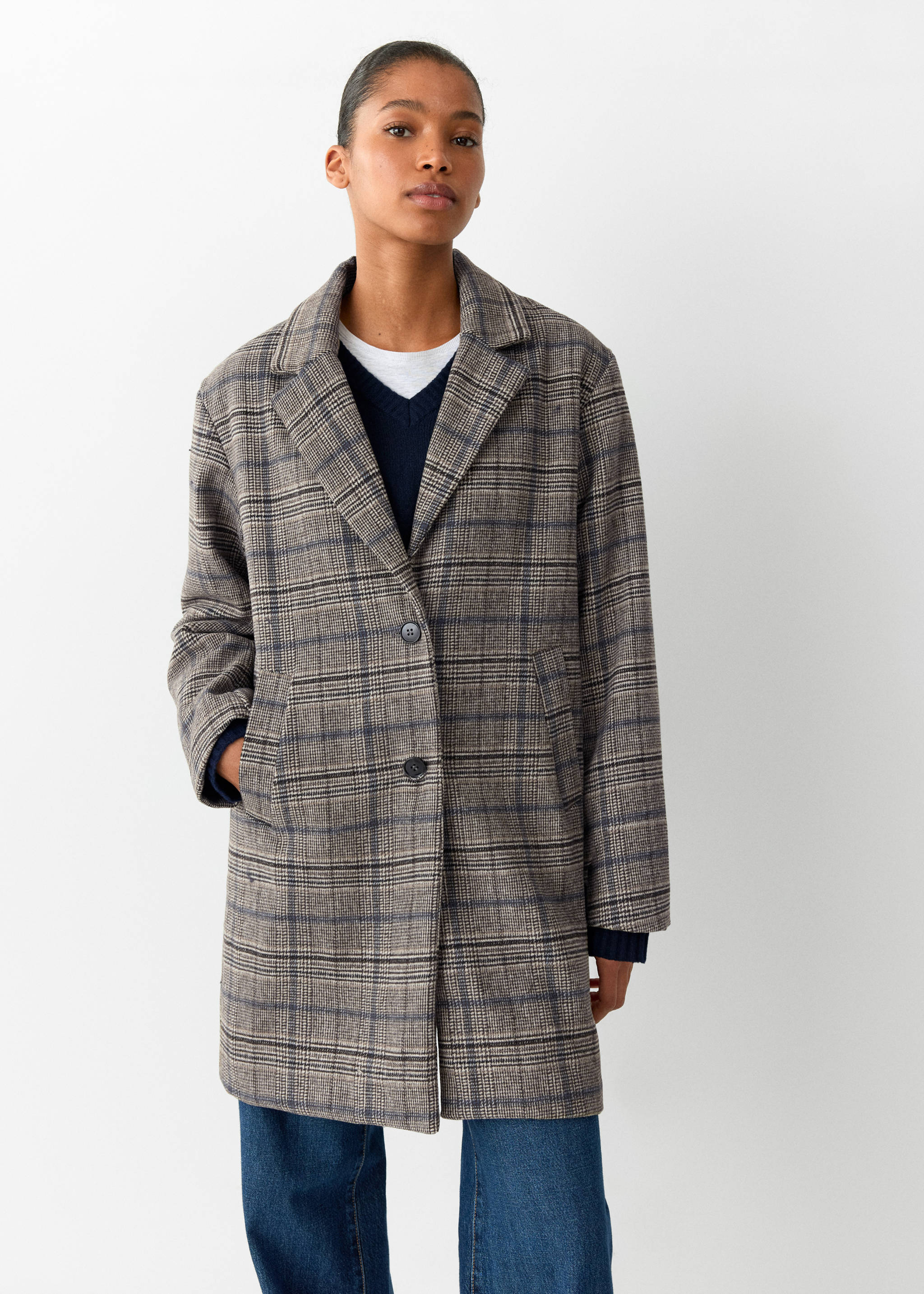 Brown plaid coat with notched lapels and front button closure.