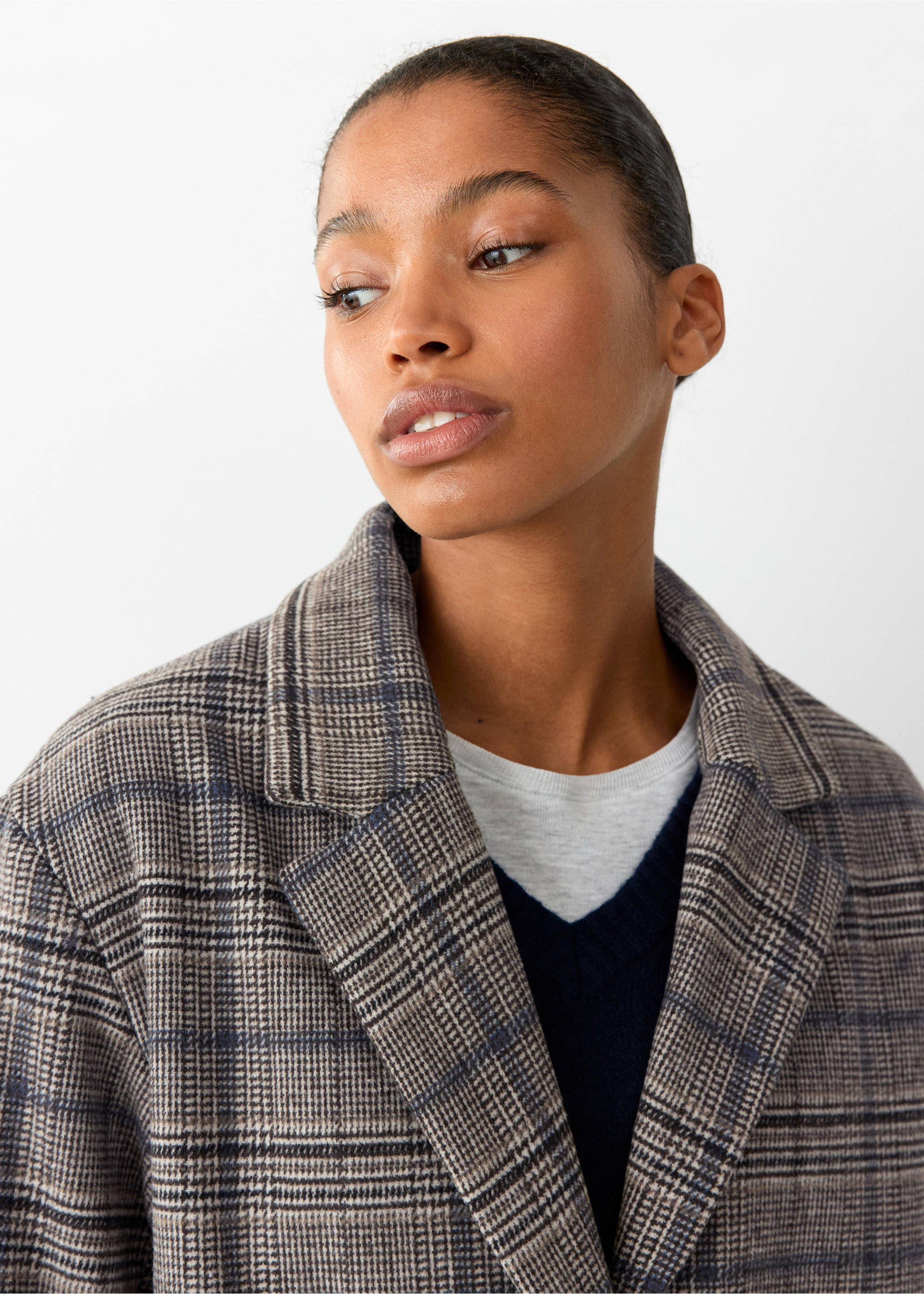 Close-up of a brown and grey plaid coat with lapel collar worn over layered tops., Grey. Ref: 37016749-00.