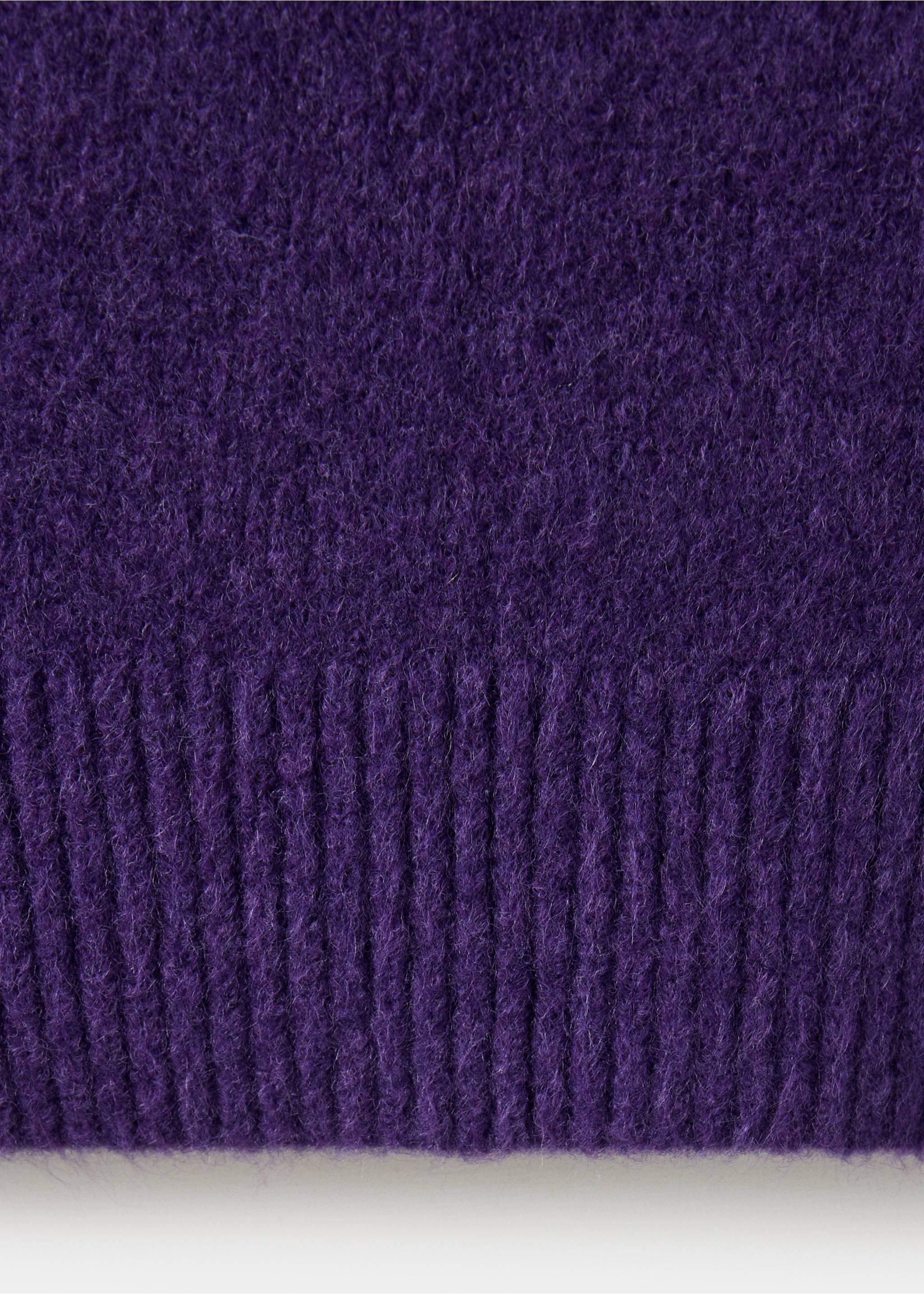 Close-up of the fuzzy purple knit fabric and ribbed hem of a jumper., Purple. Ref: 37017782-00.