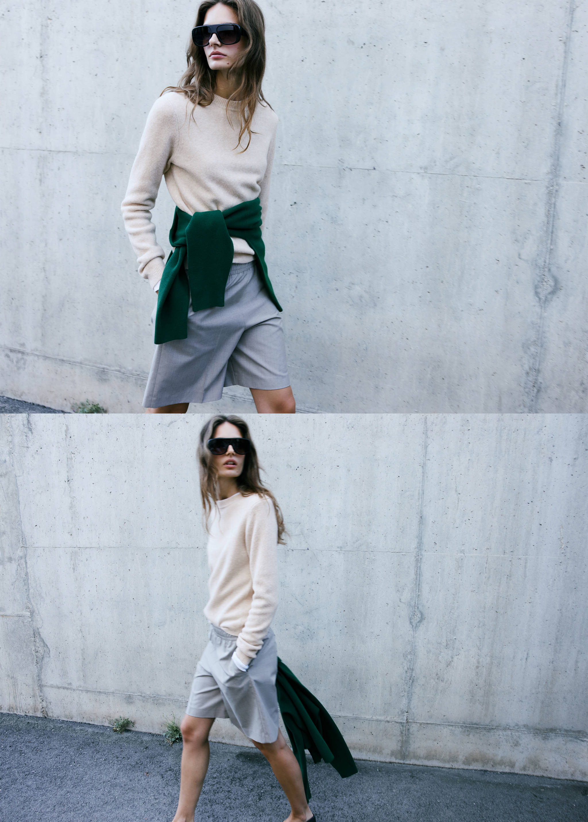 Cream round-neck jumper worn with grey shorts and a green jumper tied at the waist.