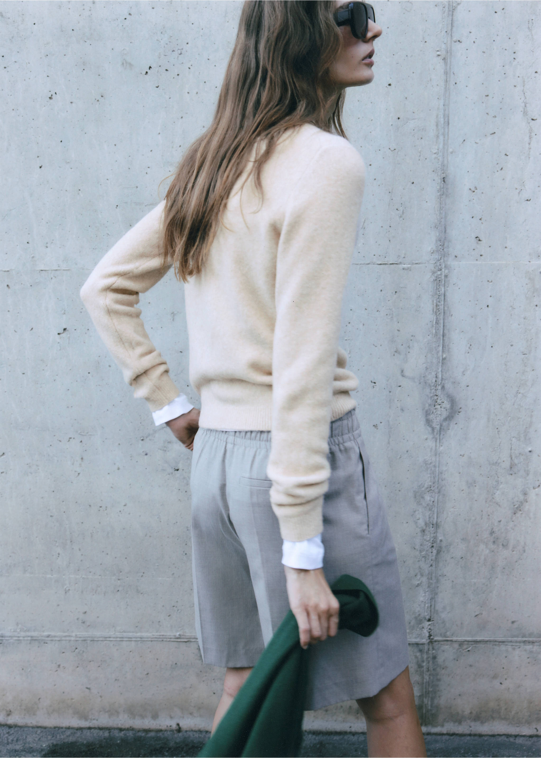 Cream knit jersey viewed from behind, paired with grey trousers., Light/Pastel Grey. Ref: 37017783-00.