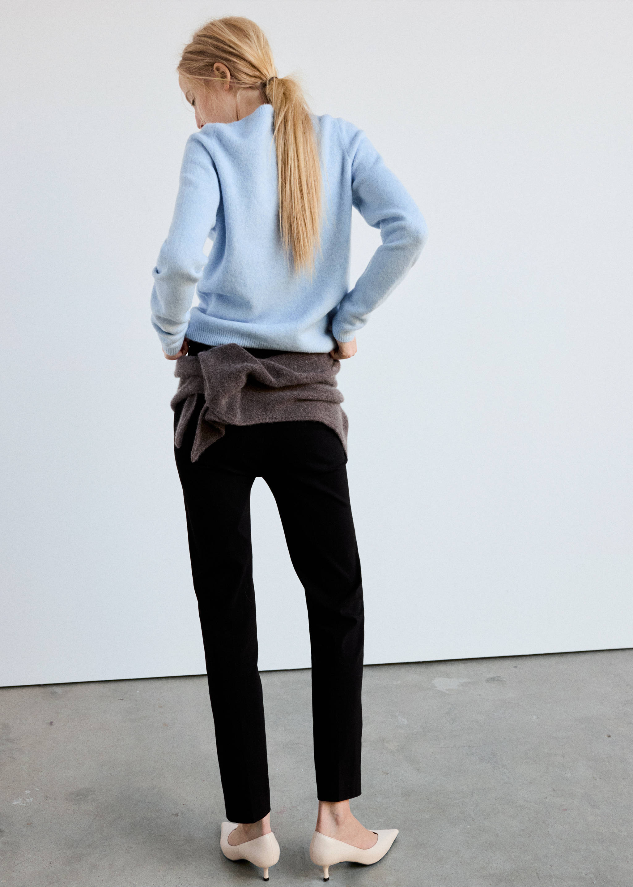 Back view of a light blue knitted jersey worn with black trousers., Sky Blue. Ref: 37017783-00.