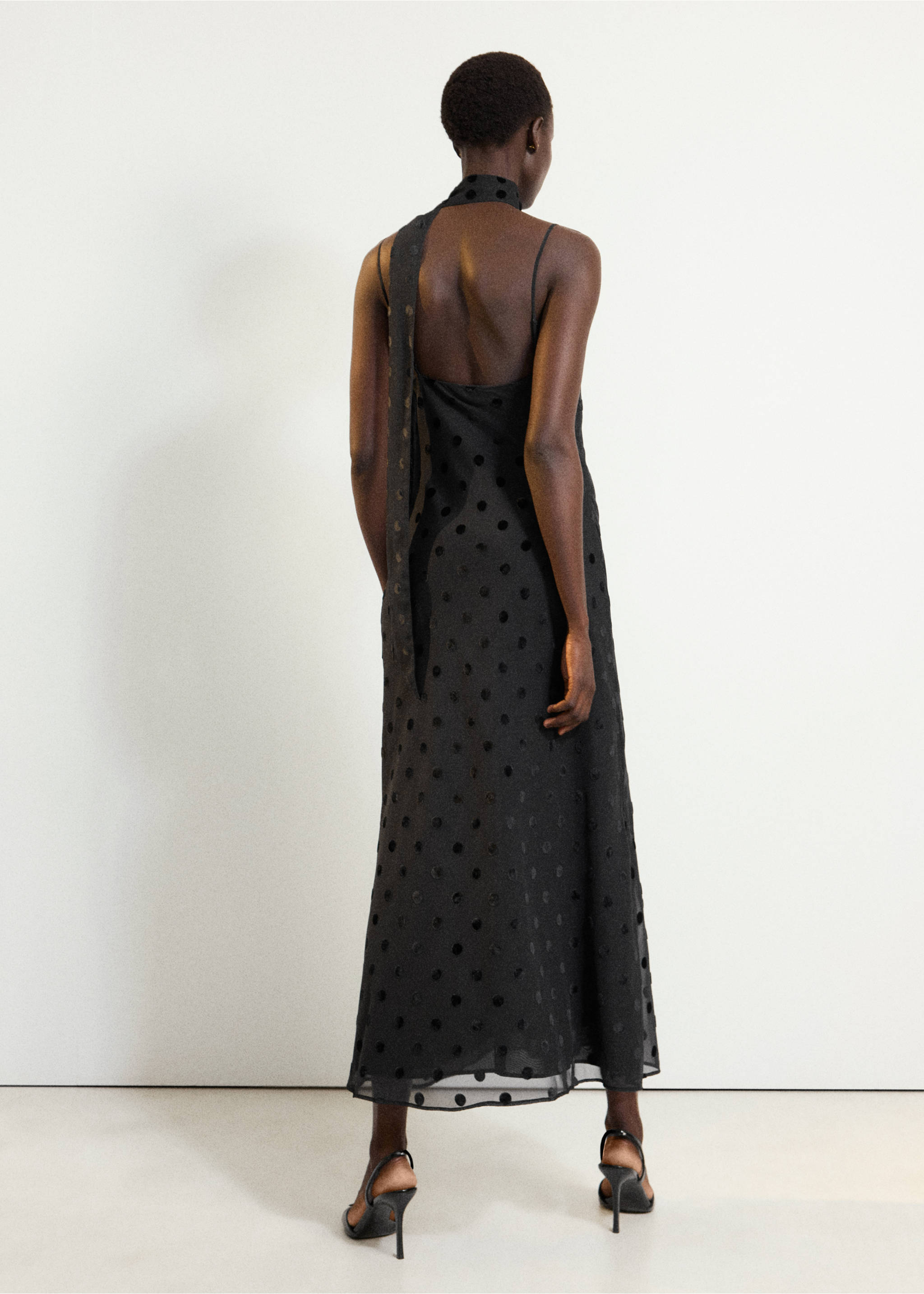 Back view of a black polka-dot maxi dress with thin straps and a halter neck., Black. Ref: 37017785-00.