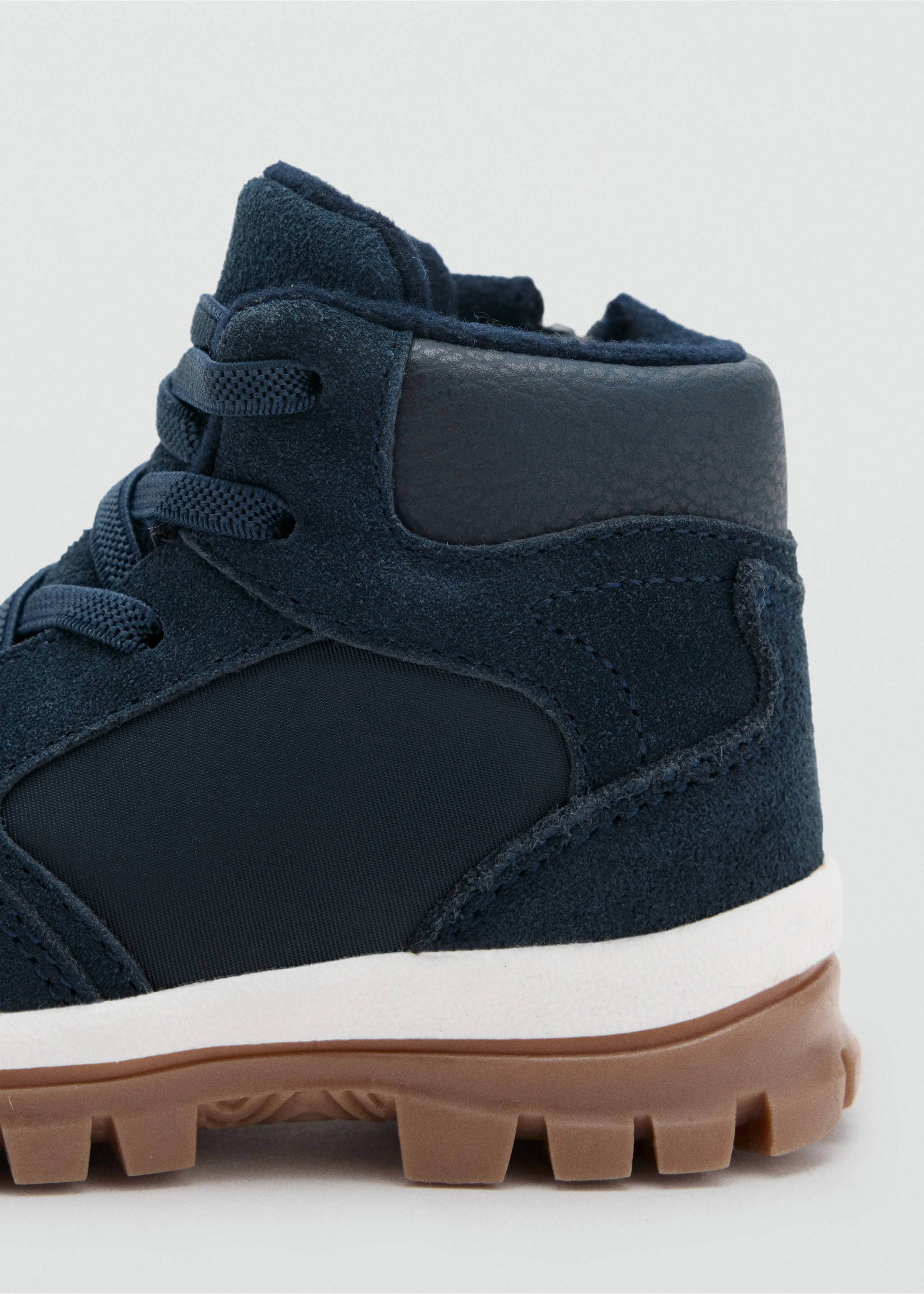 Navy blue kids boot close-up showing suede upper and rugged sole., Navy. Ref: 37017788-00.