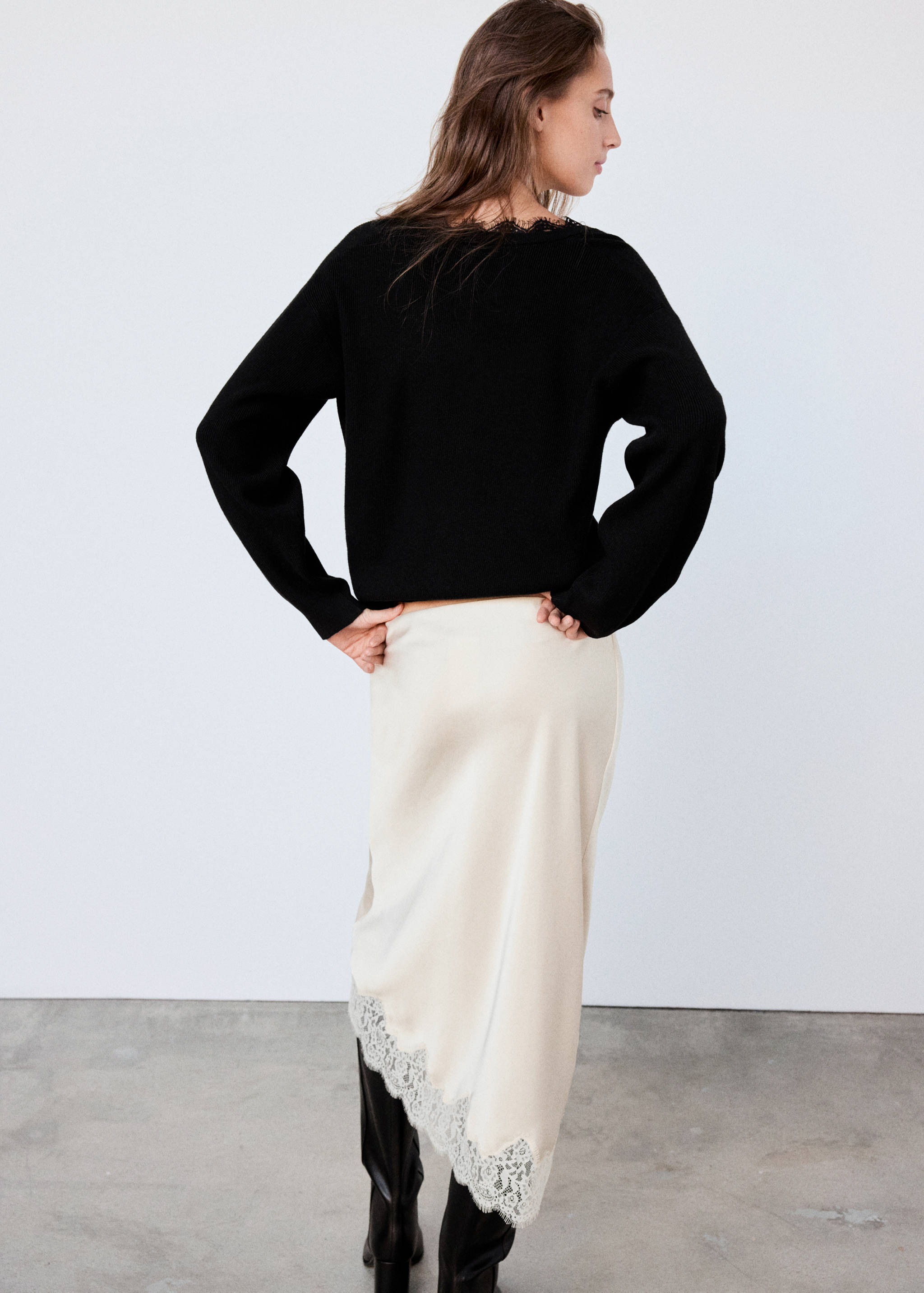 Black jersey with V-neckline and lace trim, back view.