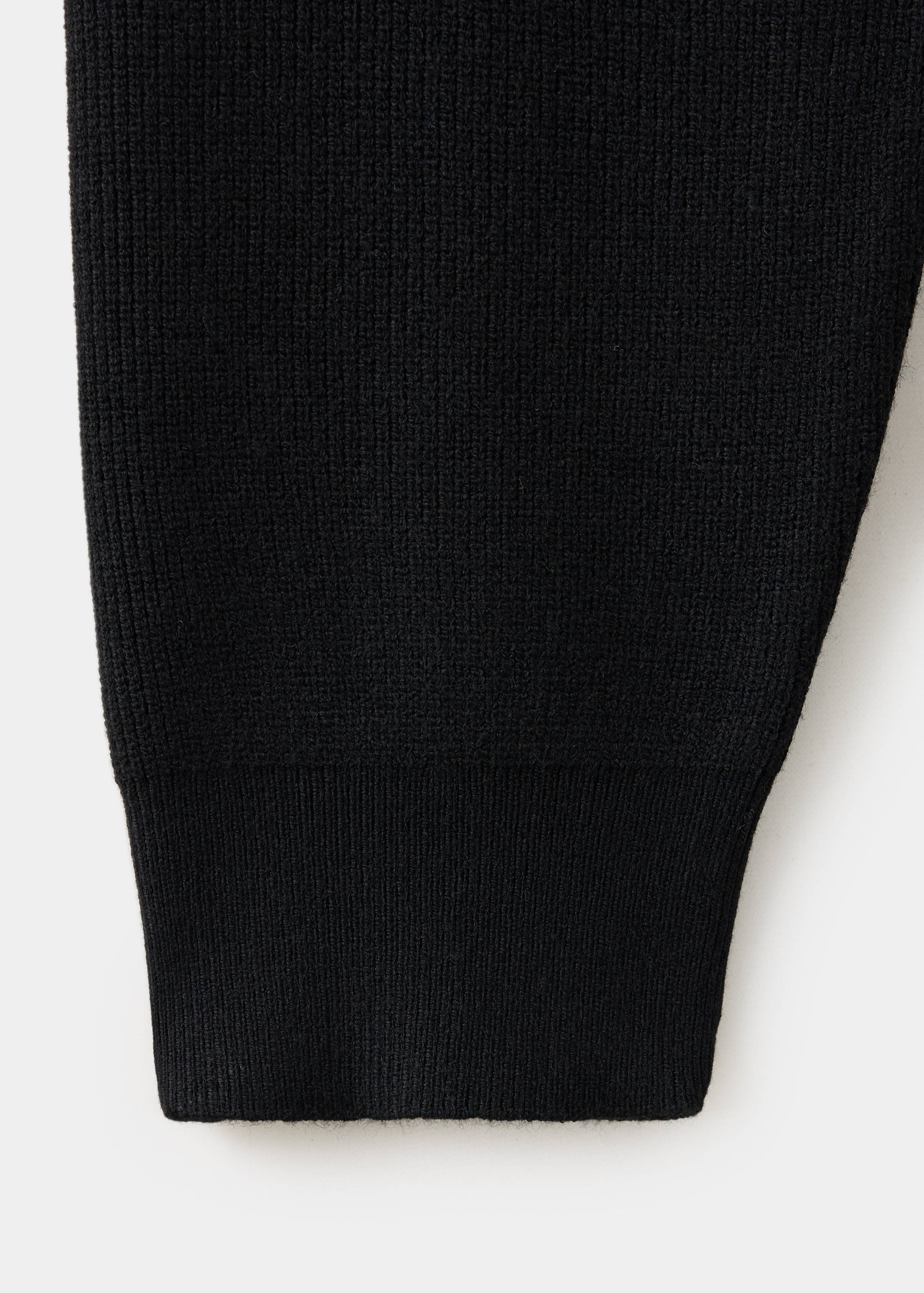 Close-up of the black jersey knit fabric texture.