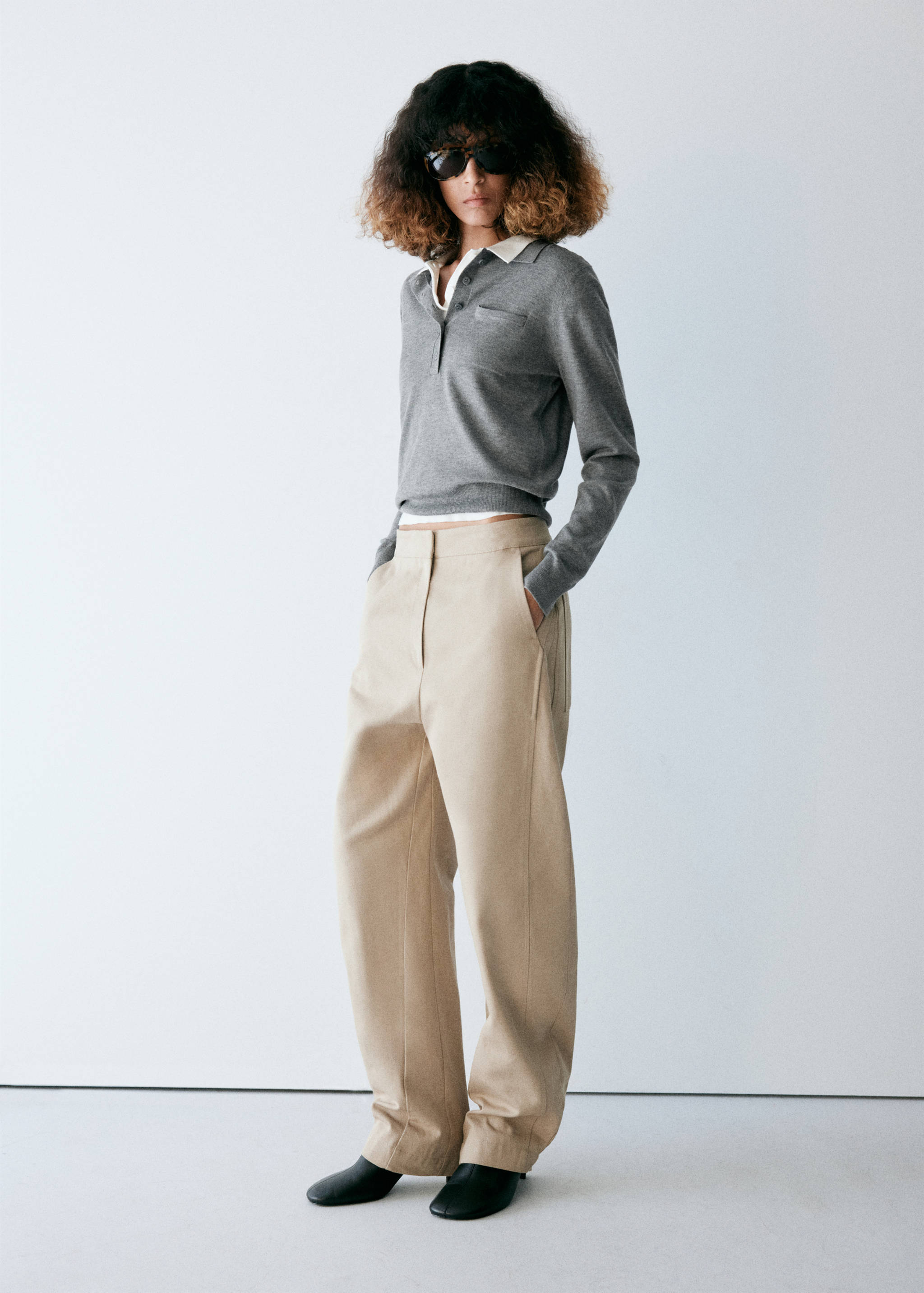 Grey jersey with a contrasting white polo collar and button placket.