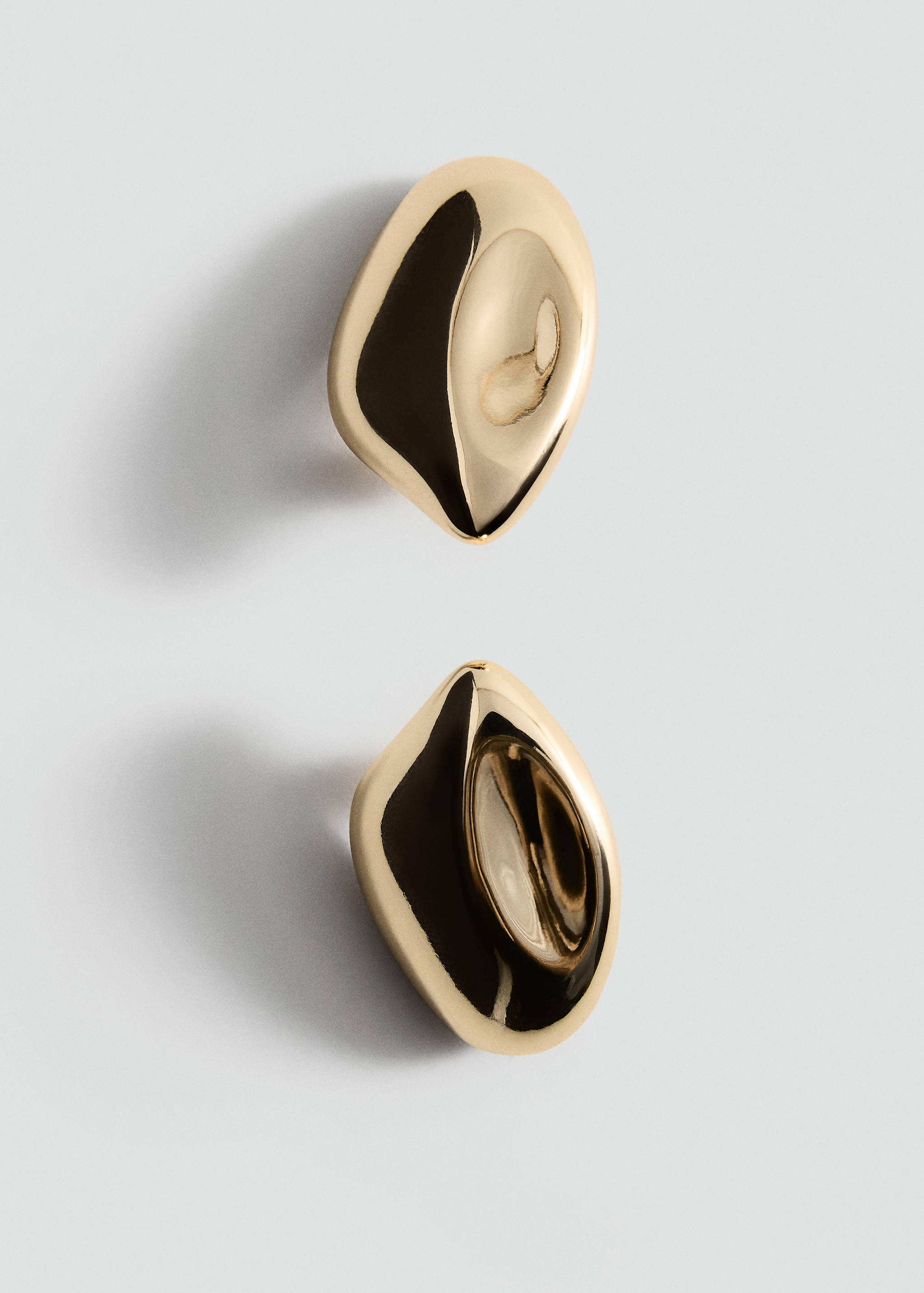 Glossy gold-coloured earrings with an irregular organic shape.