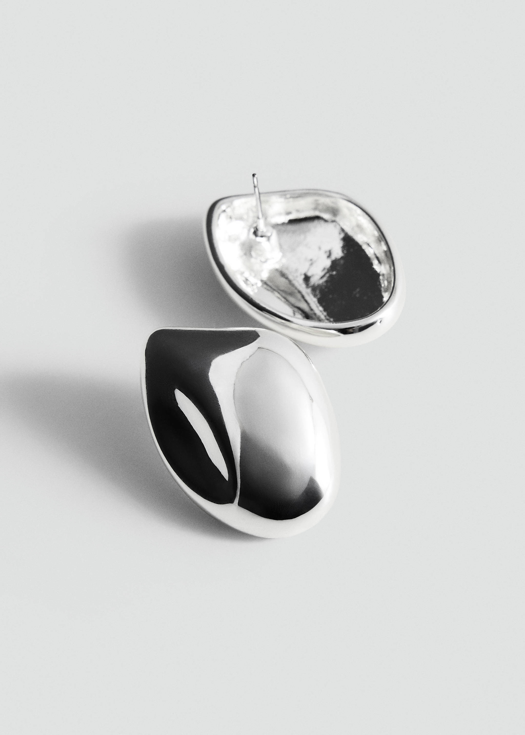 Silver-toned organic metallic earrings with a polished finish.