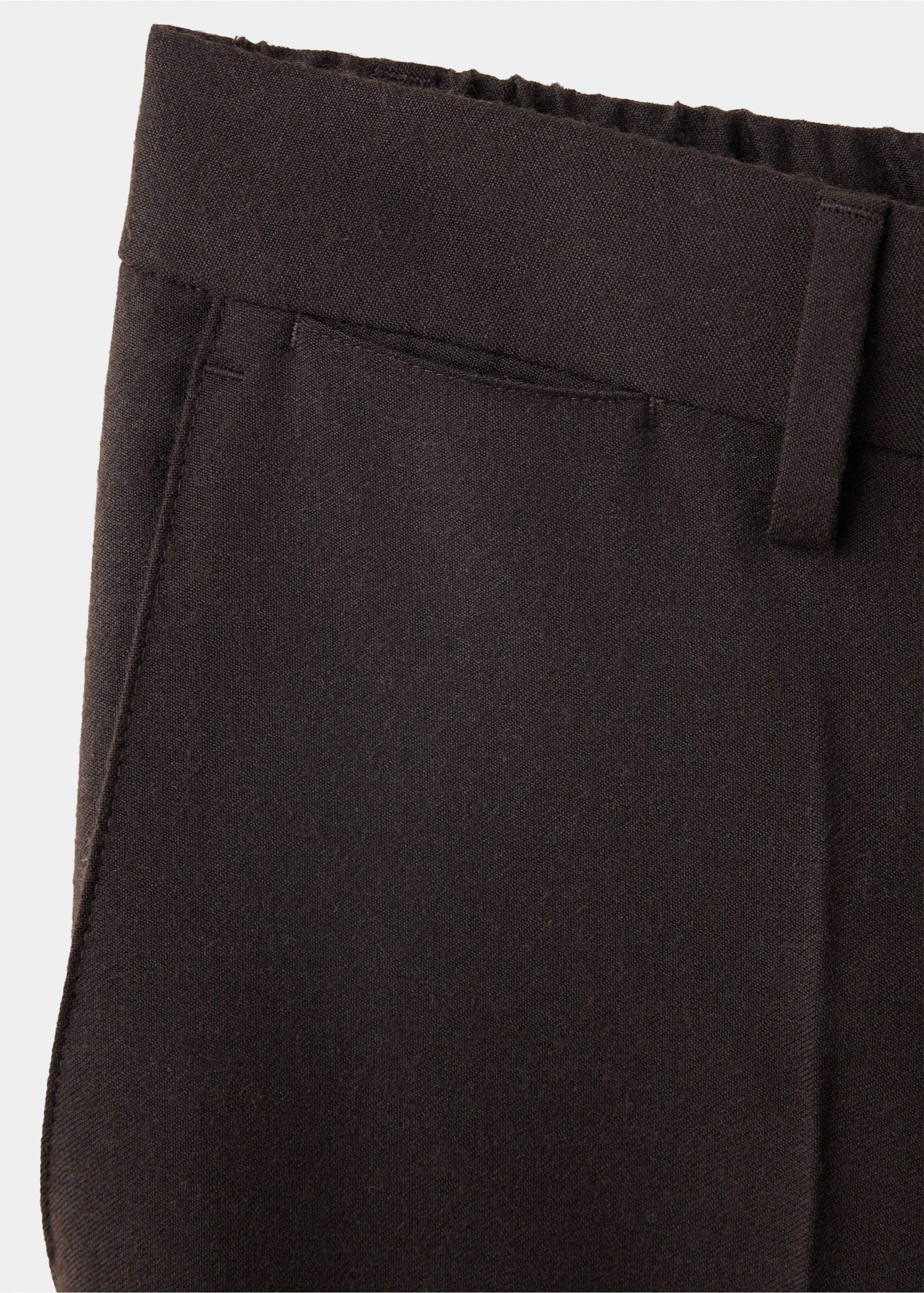 Close-up of dark brown men's trousers showing the waistband and pocket detail., Brown. Ref: 37017886-00.