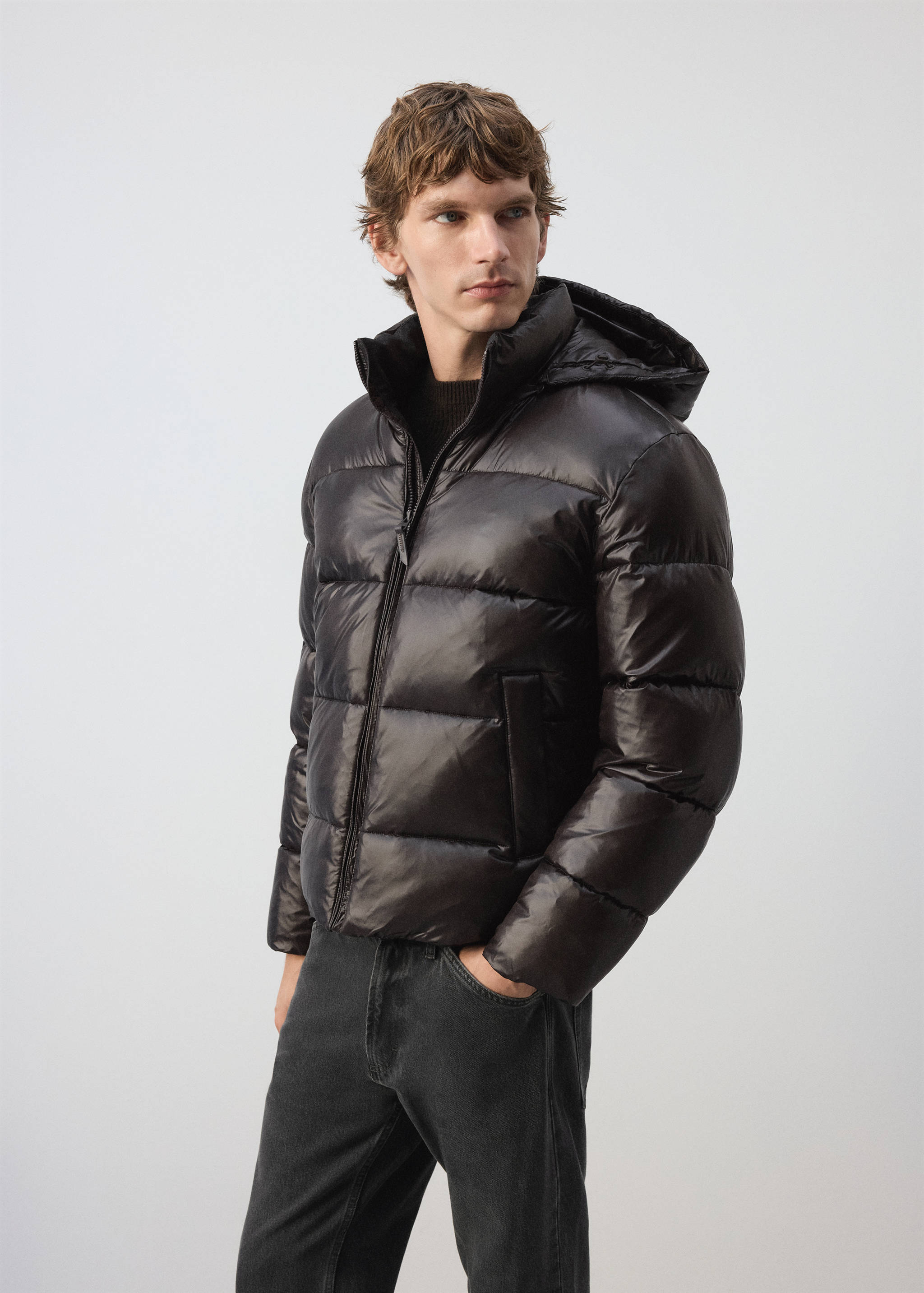 Glossy dark brown quilted anorak with a hood and high collar.
