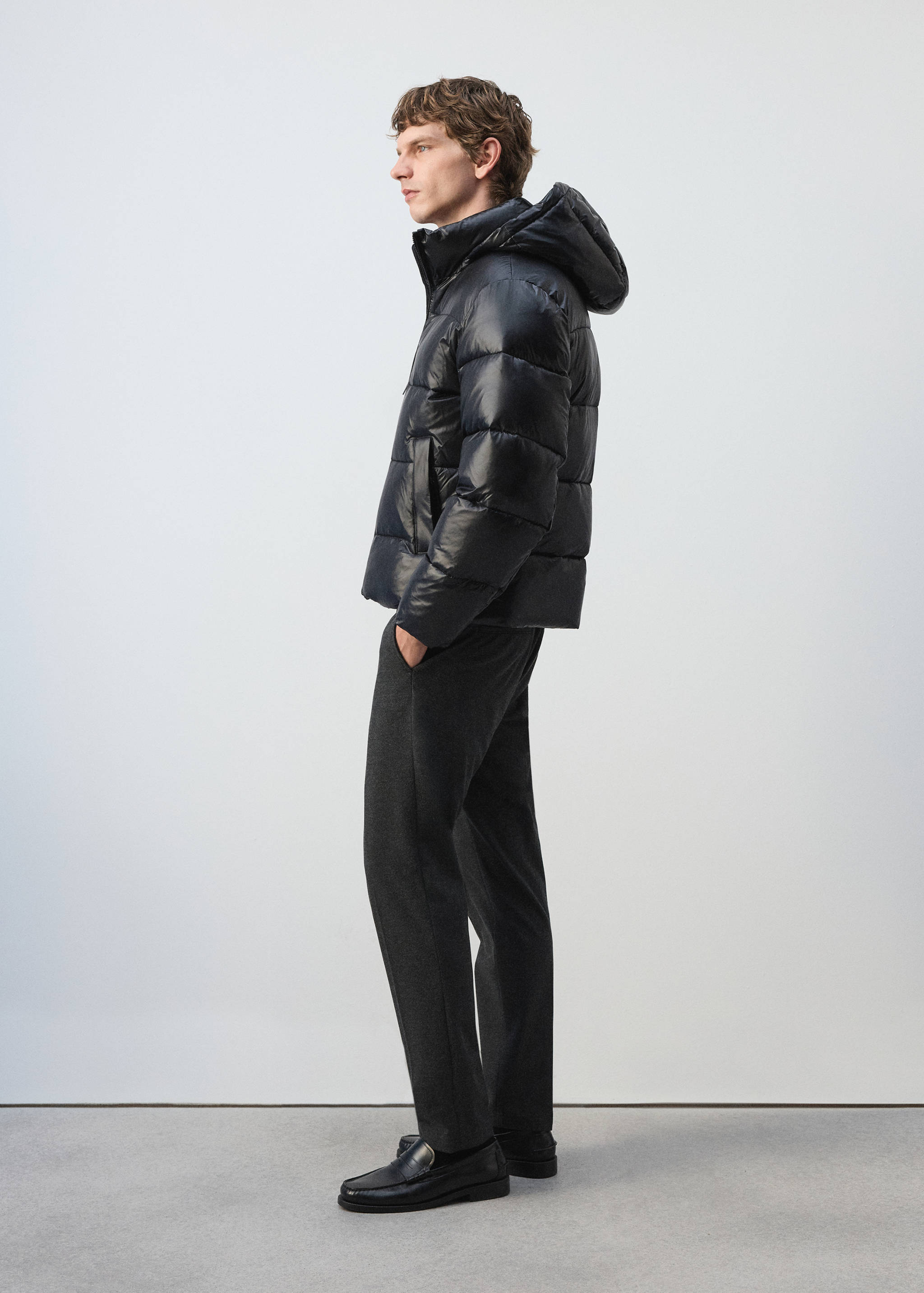 Navy blue quilted anorak with a hood.