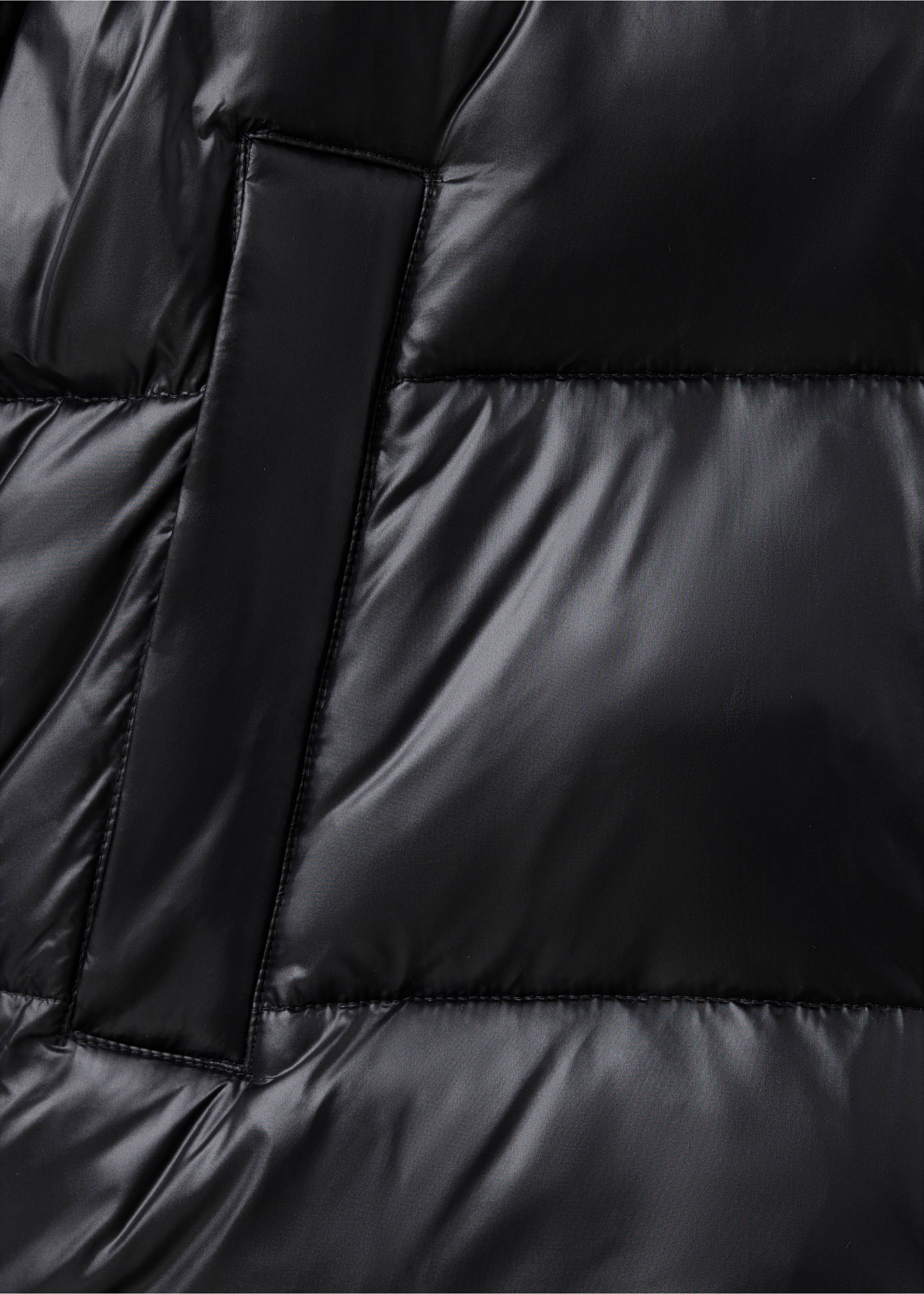 Close-up of black quilted anorak fabric and pocket., Black. Ref: 37017892-00.