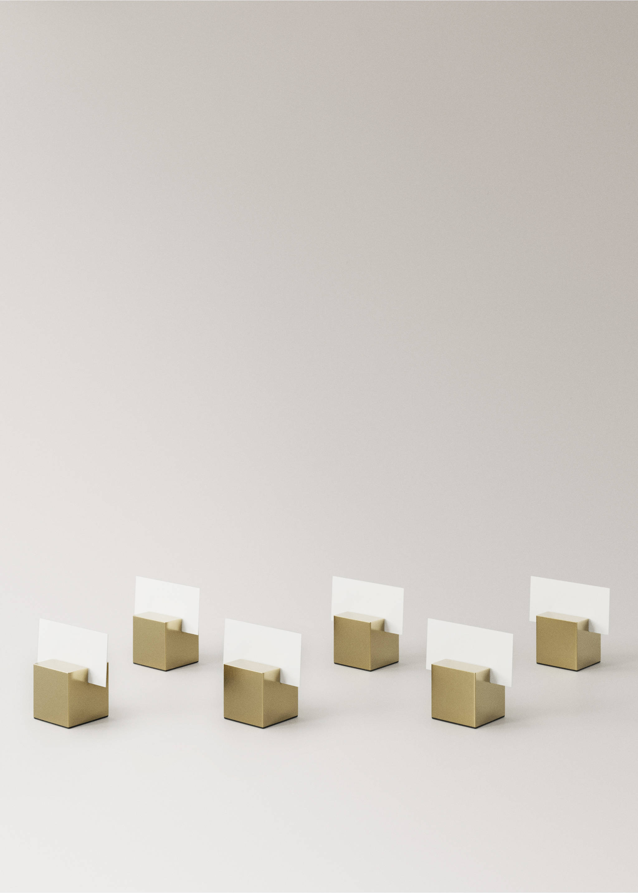 Set of six metallic gold card holders arranged in a still life., Gold. Ref: 37017893-00.