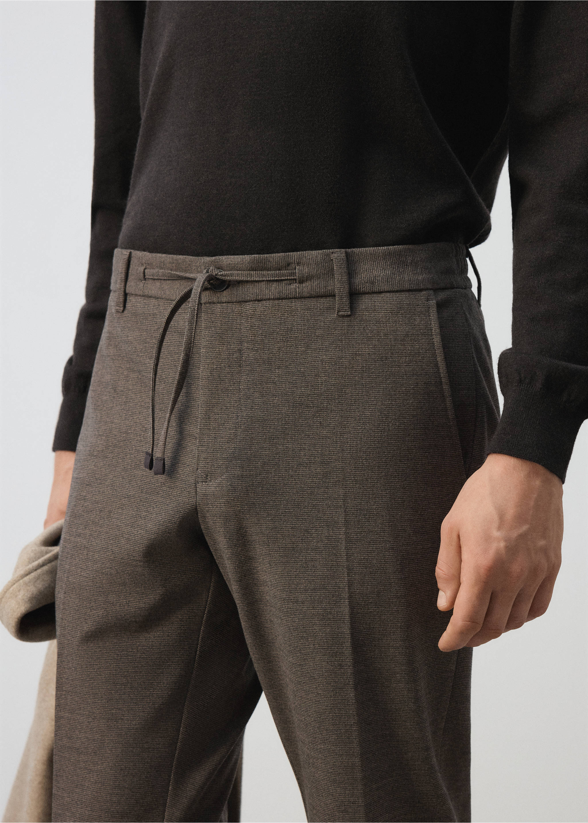 Brown trousers with drawstring waist and belt loops in a close-up view., Tobacco Brown. Ref: 37017901-00.