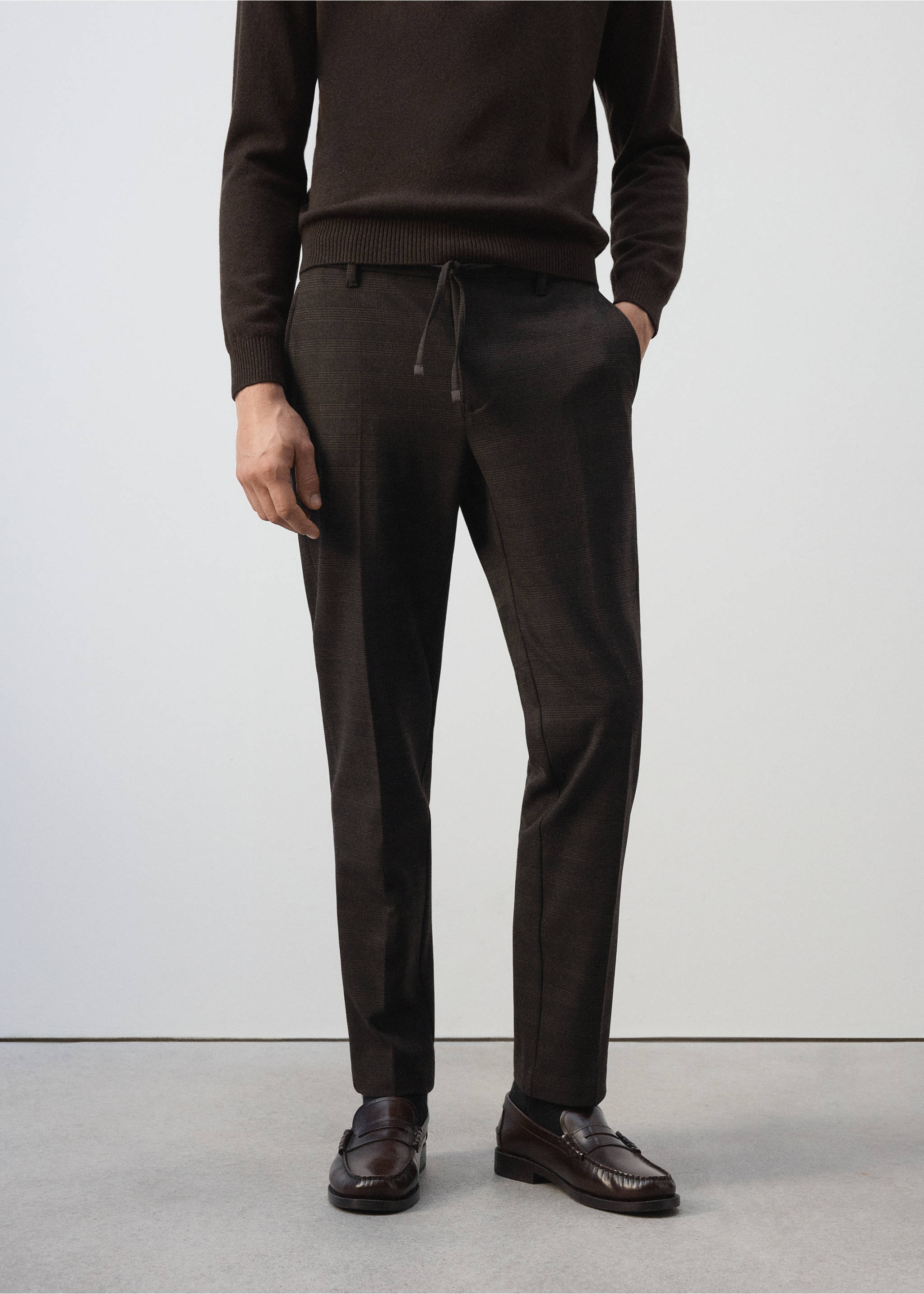 Dark brown trousers with a drawstring waistband and pressed creases., Chocolate. Ref: 37017902-00.