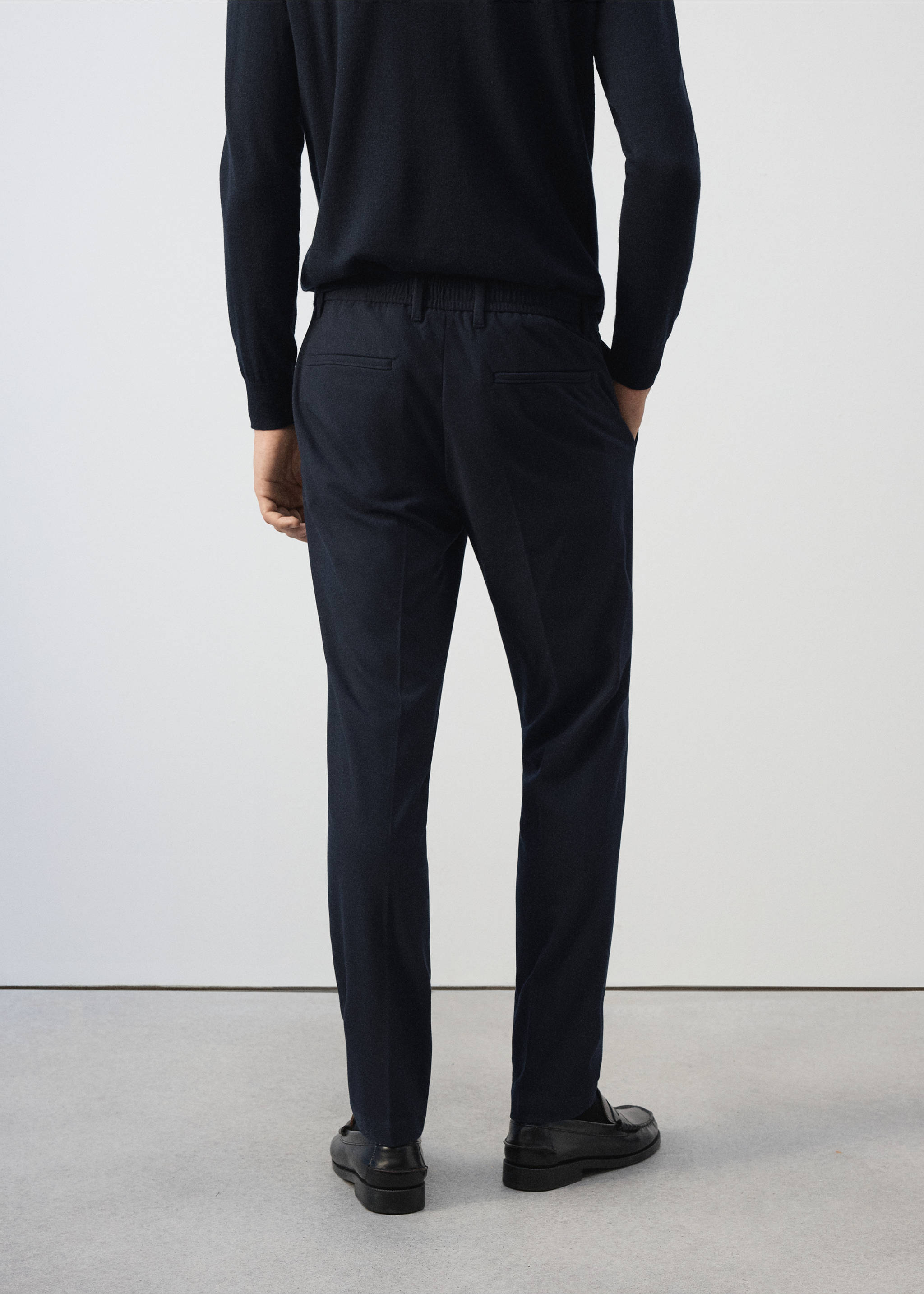 Navy blue trousers from the back, featuring a tailored fit and back pockets., Navy. Ref: 37017903-00.