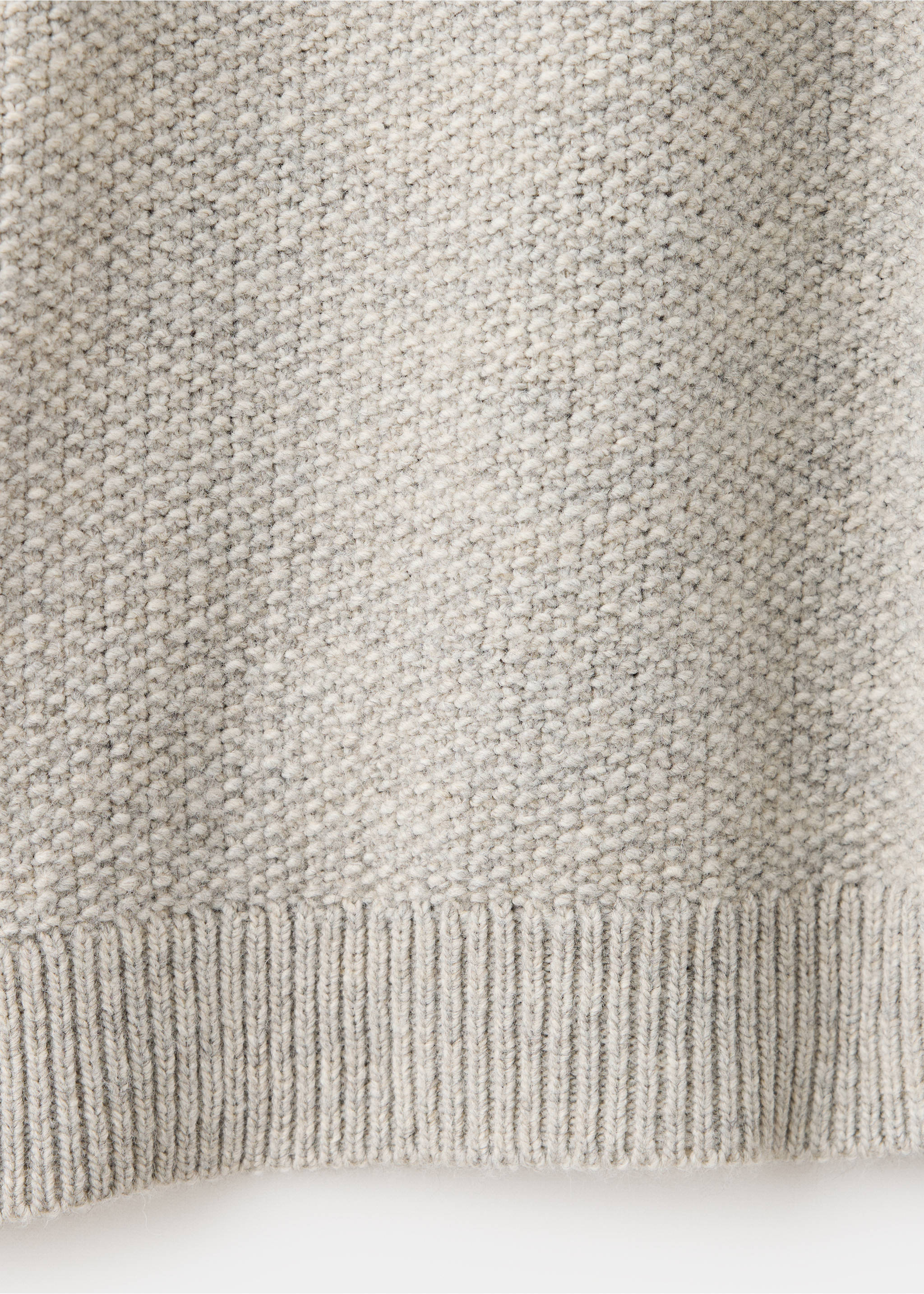 Close-up of the textured knit and ribbed hem on a grey jersey., Light/Pastel Grey. Ref: 37017911-00.