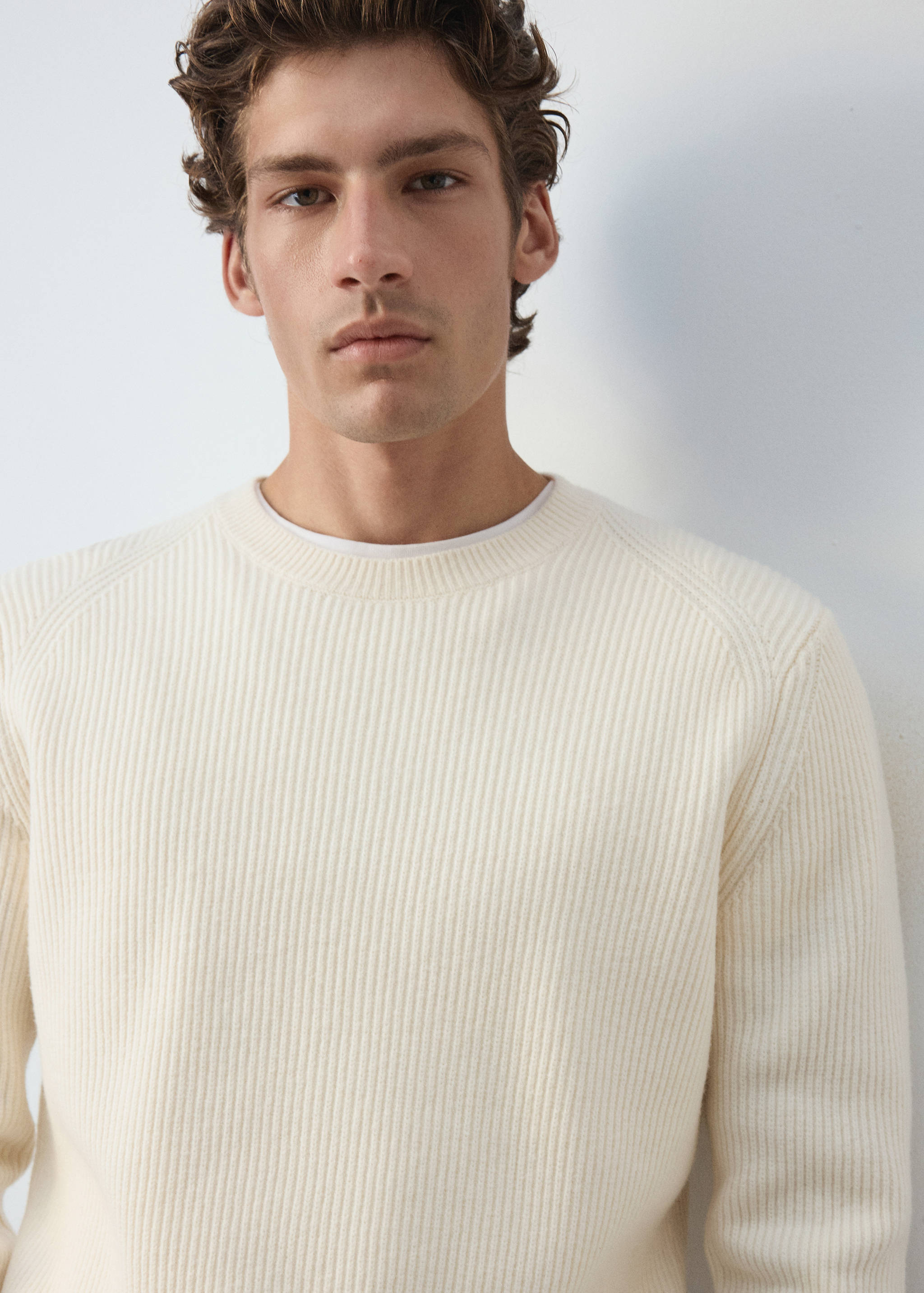 Off-white ribbed knit jersey with a crew neck.