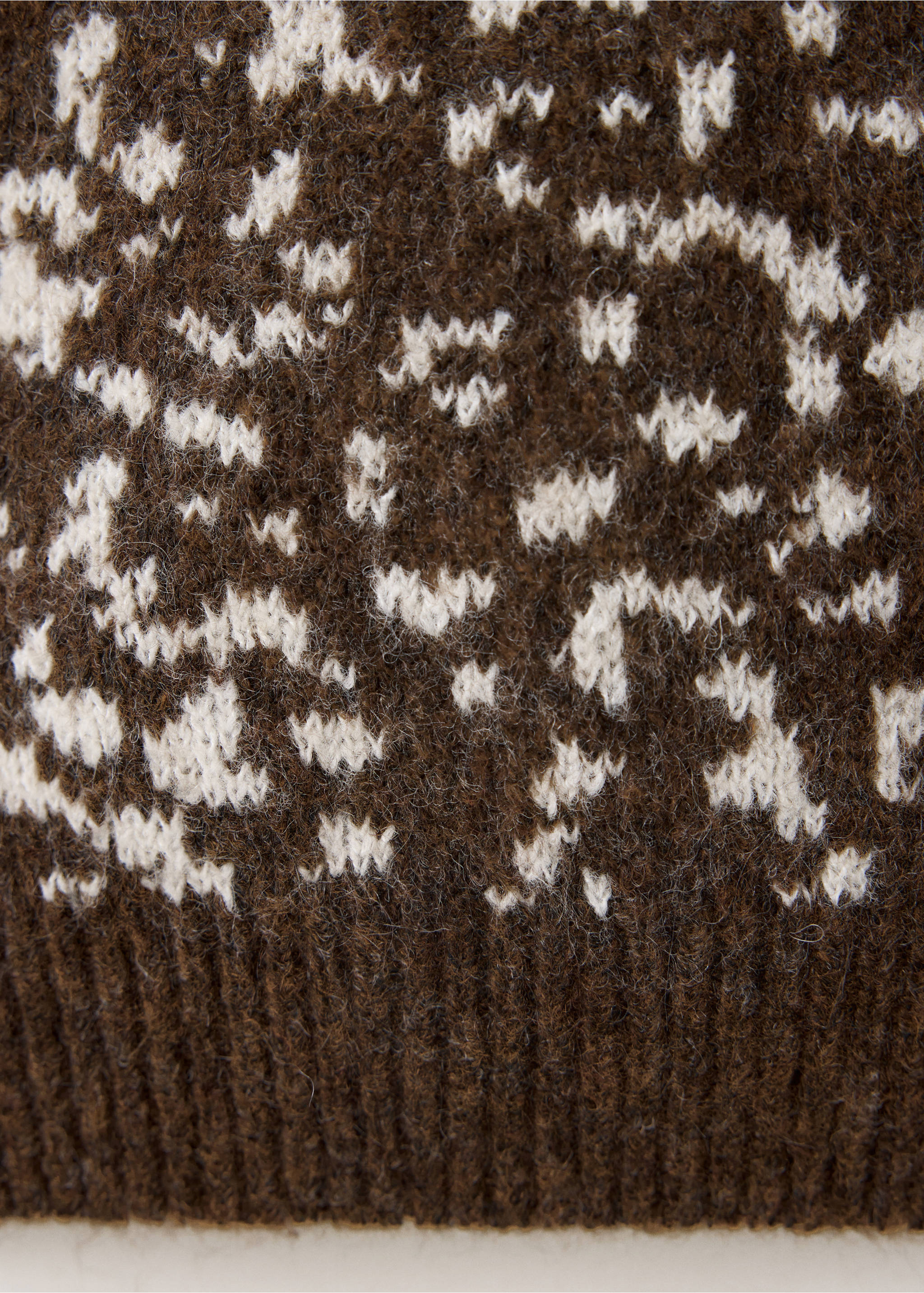 Close-up of the fuzzy knit texture and brown and cream print on a jersey., Medium Brown. Ref: 37017925-00.