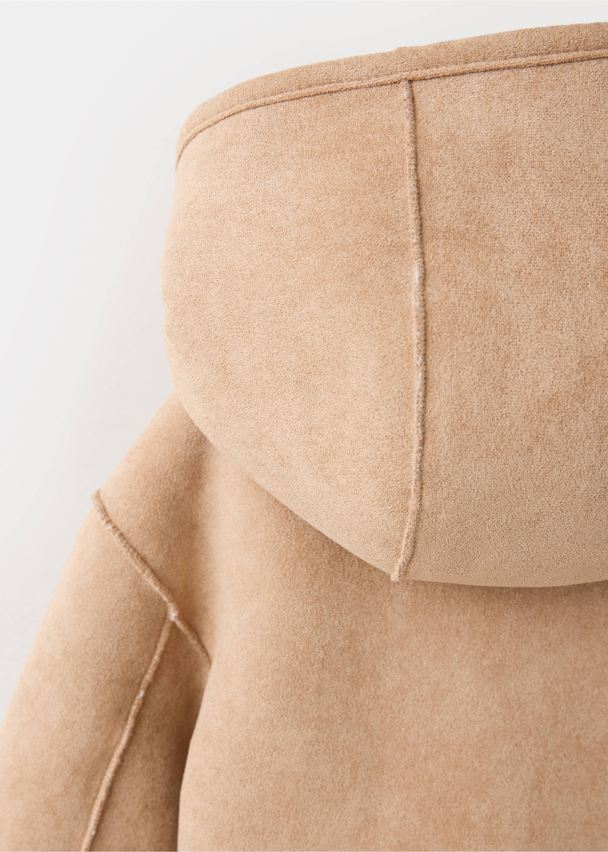 Close-up of the hood on a camel faux-suede kids' coat with visible seaming., Medium Brown. Ref: 37017929-00.