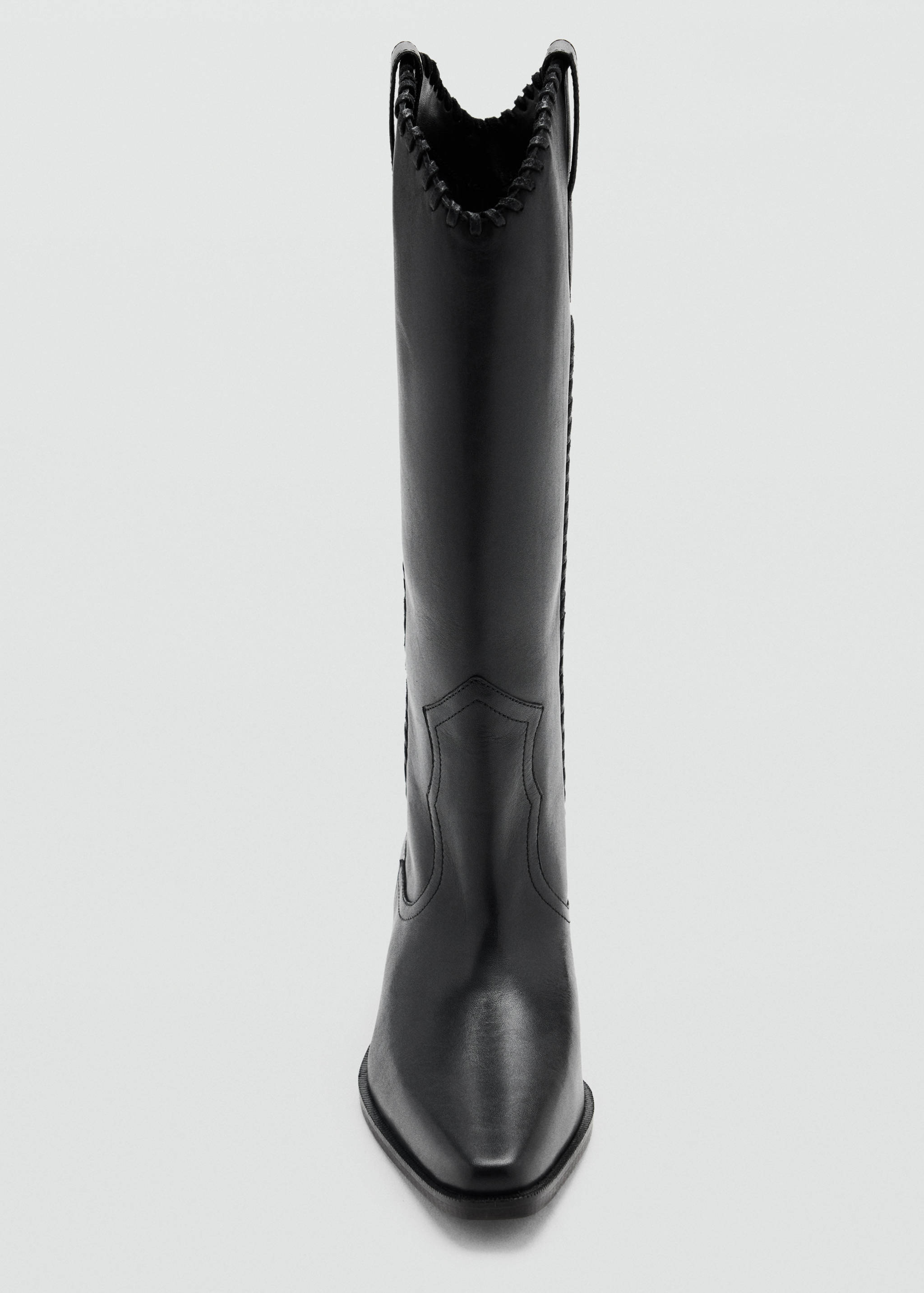 Black tall boots with pointed toe and whipstitch detail