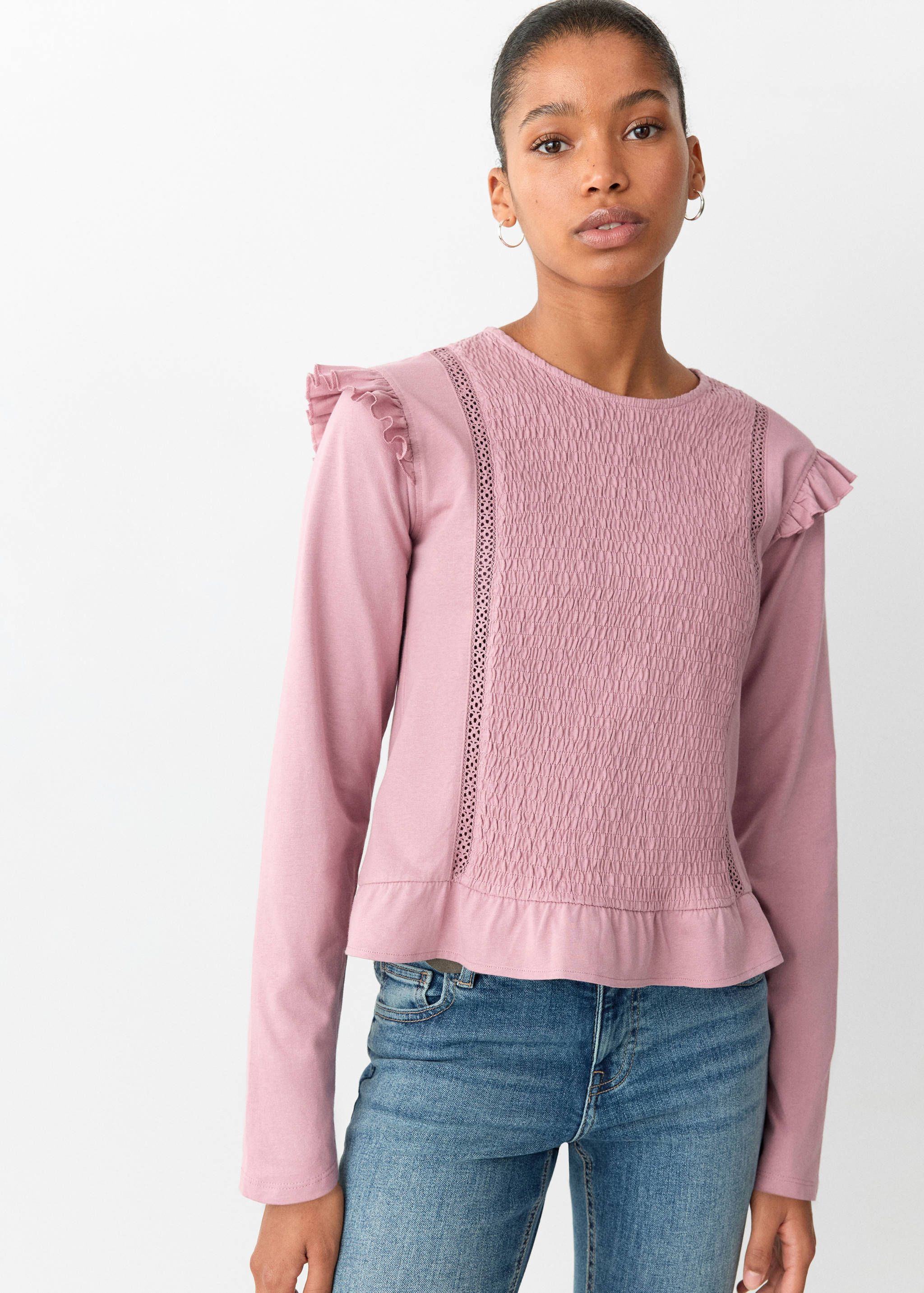 Mauve long-sleeve t-shirt with smocked chest panel, shoulder ruffles, and a ruffled hem.