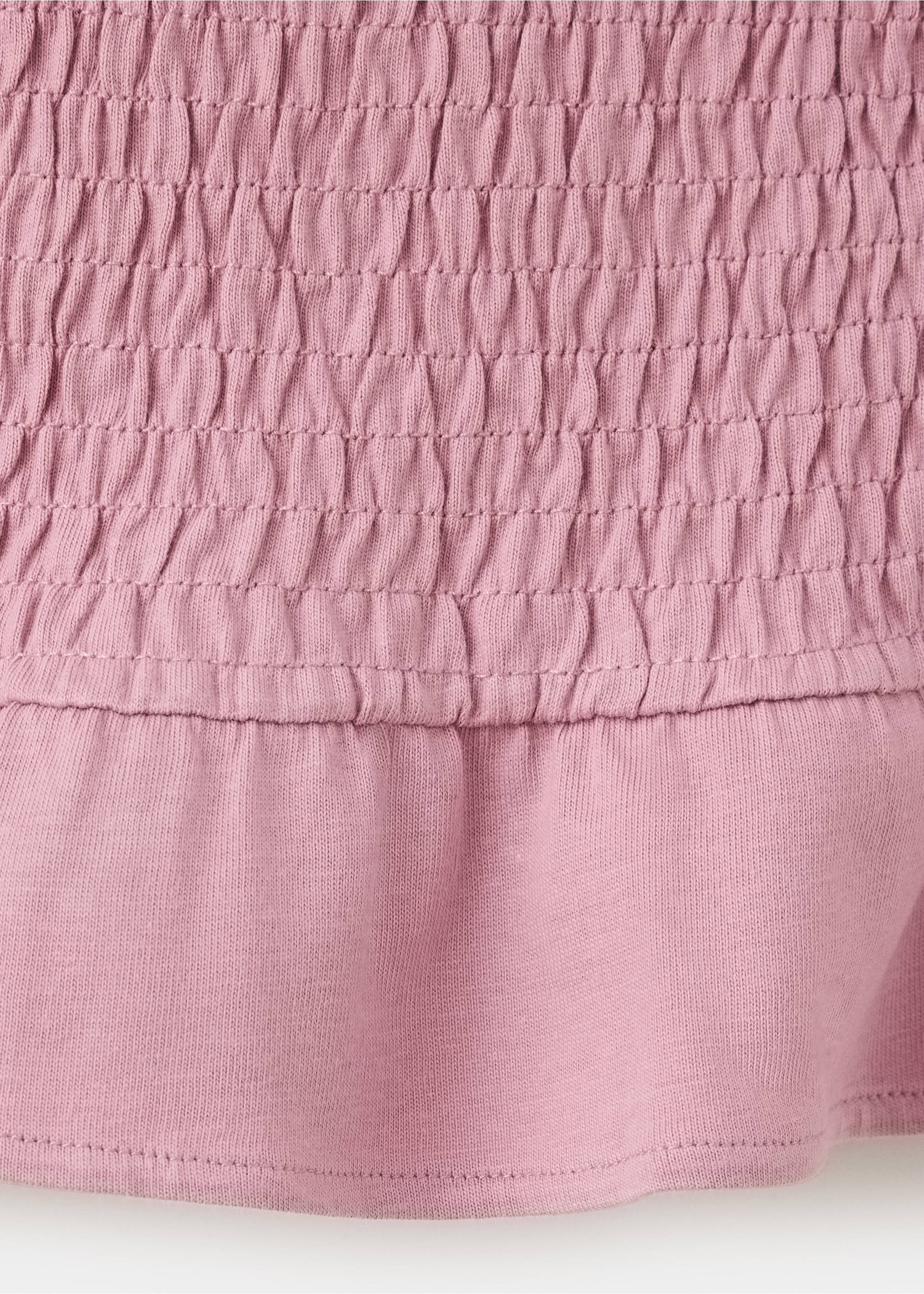 Pink t-shirt fabric detail featuring a smocked upper section and smooth hem., Pink. Ref: 37018284-00.