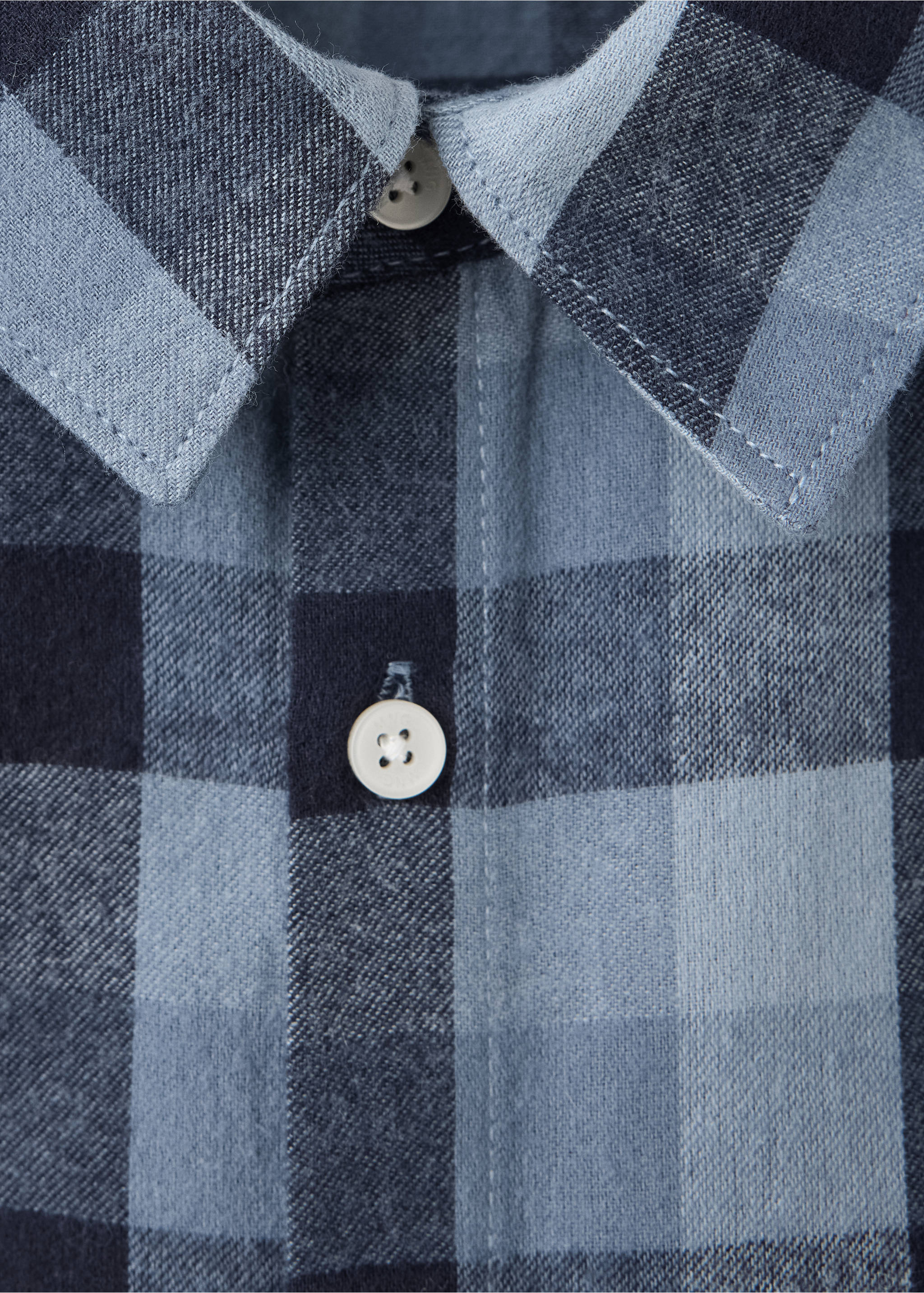 Close-up of a blue and navy checked shirt collar and button placket., Navy. Ref: 37018633-00.