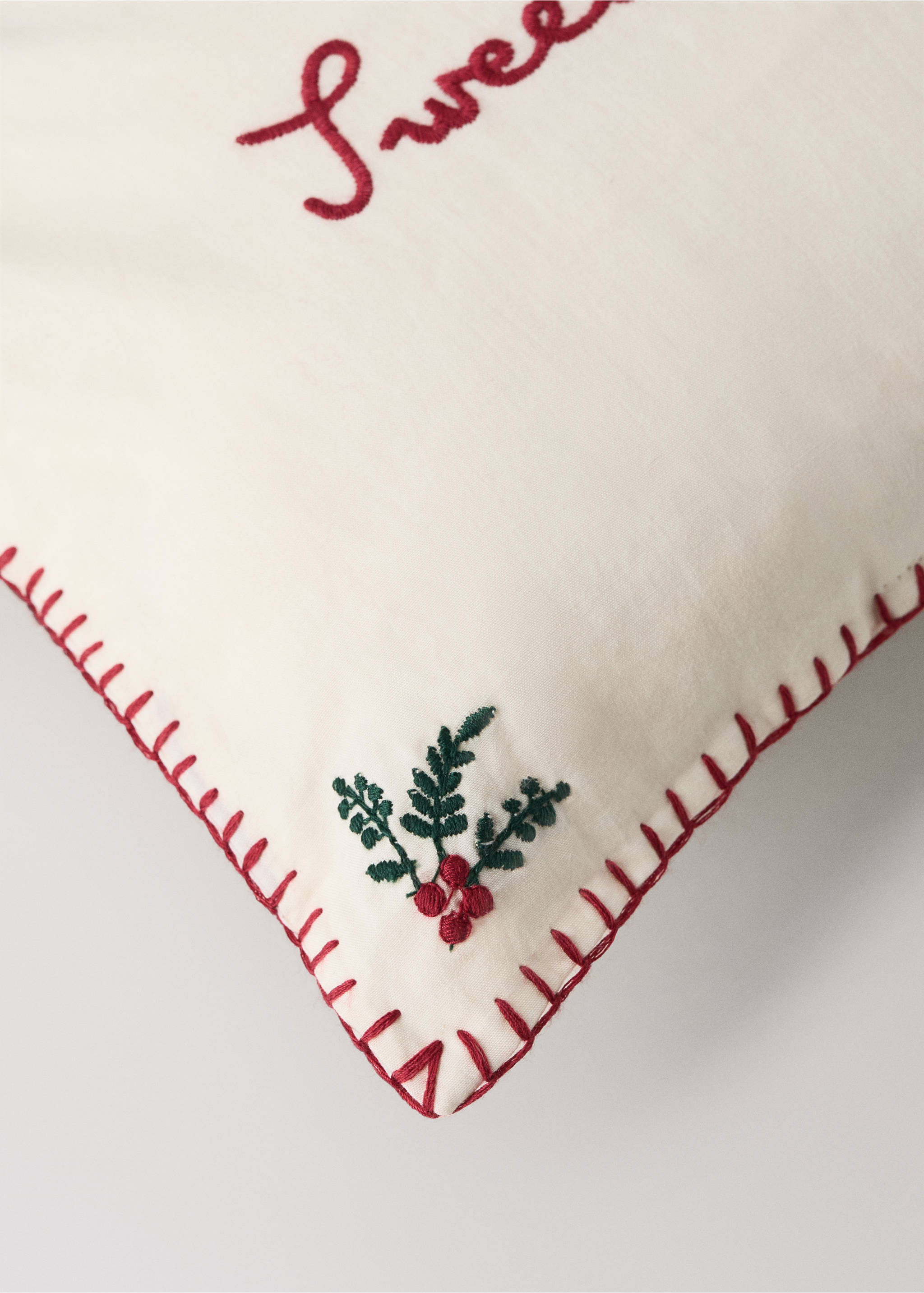 Off-white cushion detail with red blanket stitch and embroidery., Red. Ref: 37018637-00.