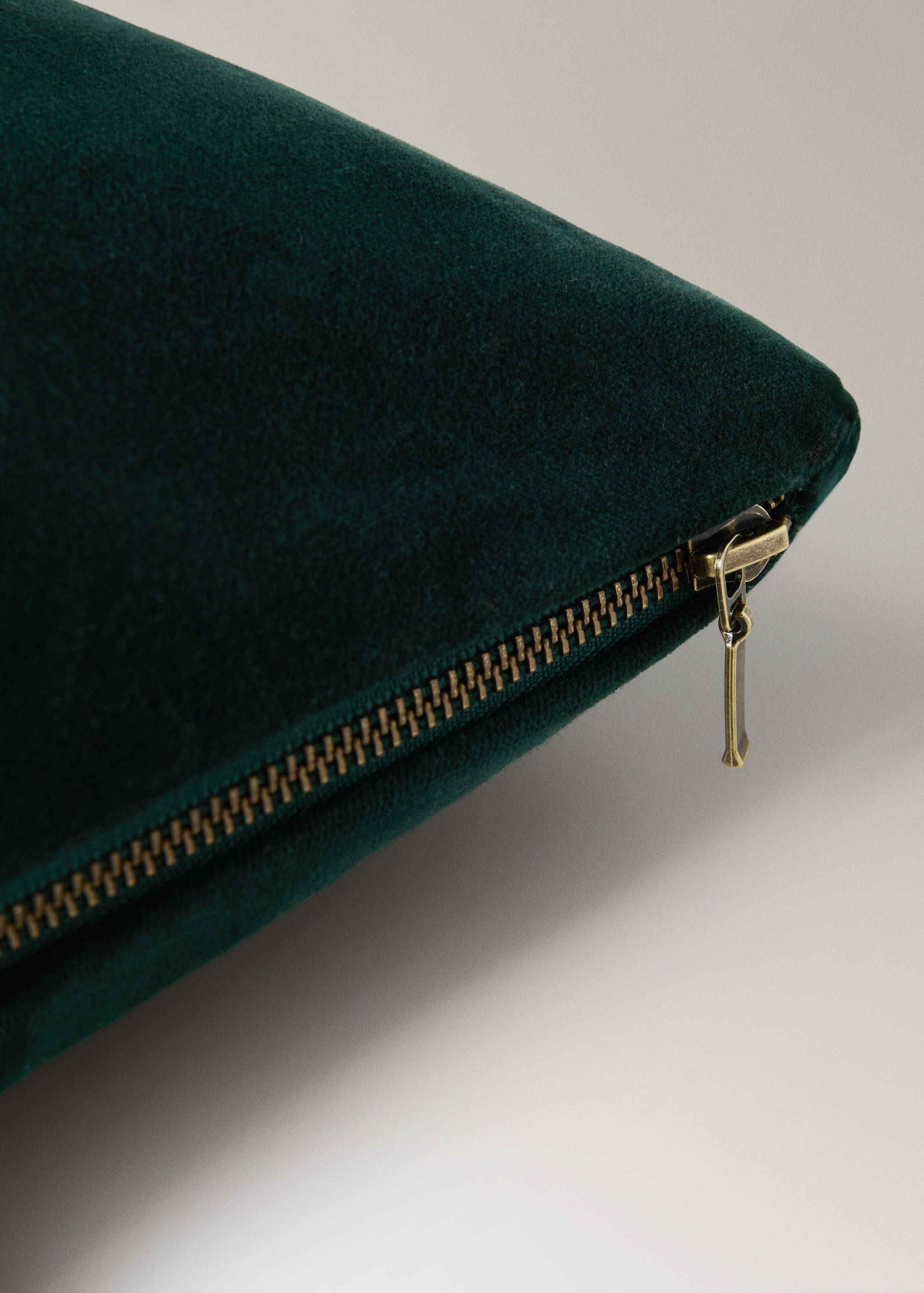 Dark green velvet cushion cover zipper detail