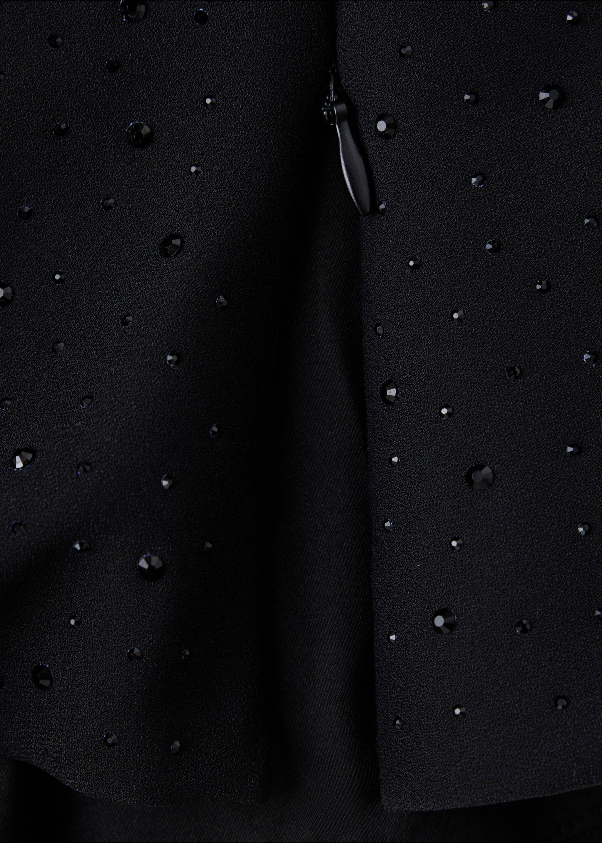 Close-up of a black blouse fabric with rhinestone embellishments., Black. Ref: 37019127-00.