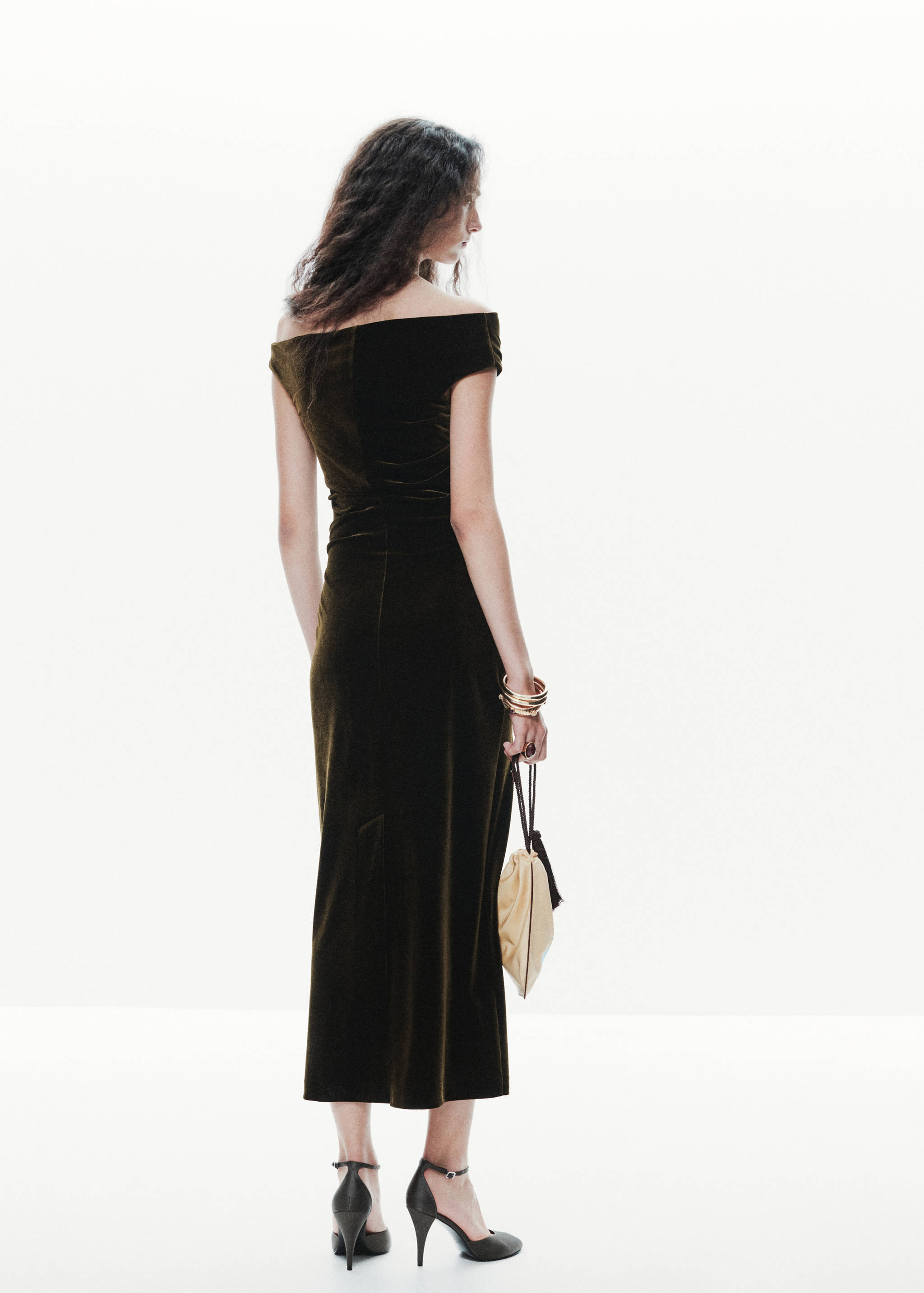 Dark olive green velvet midi dress from the back with off-the-shoulder neckline.