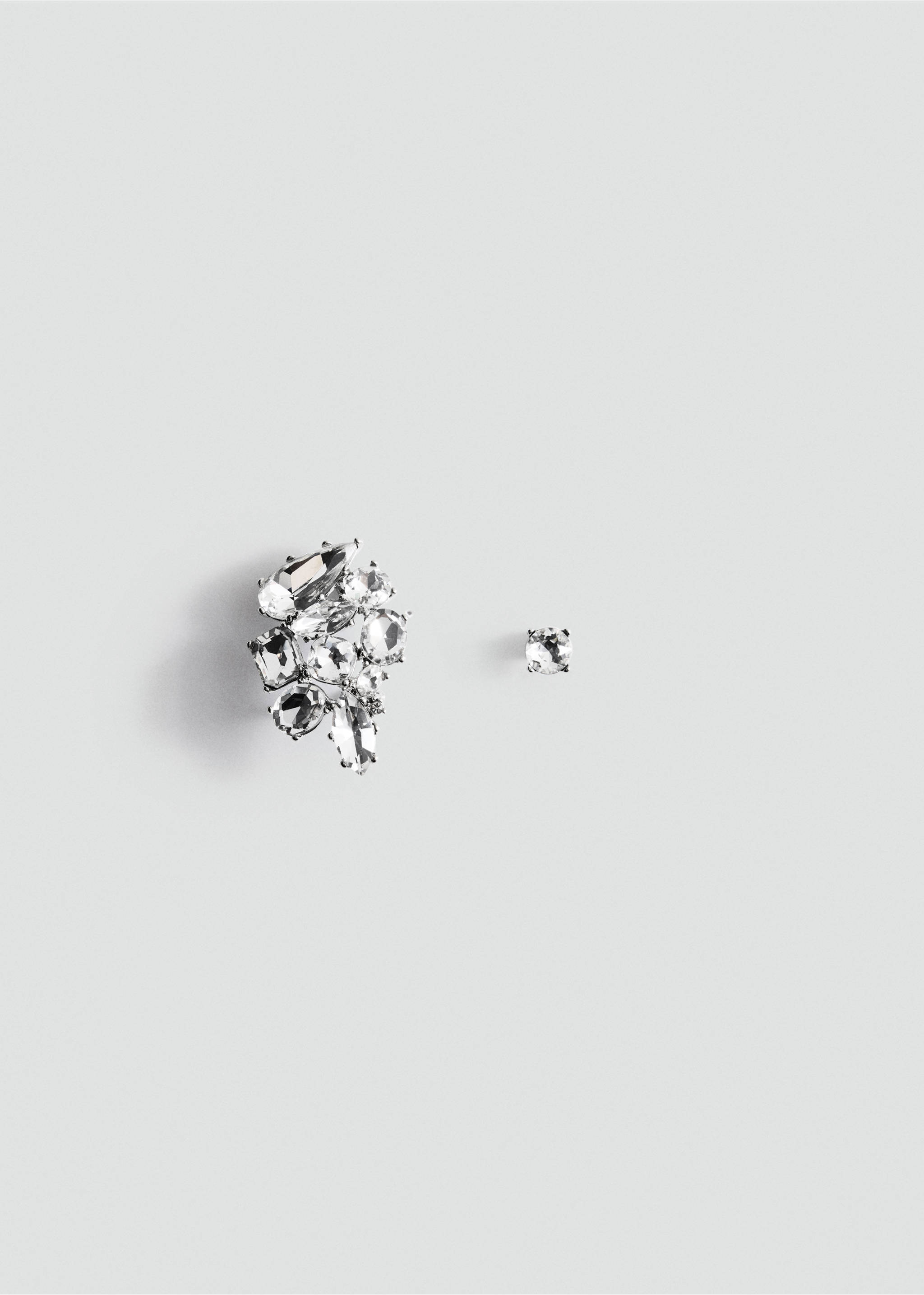 Asymmetrical silver-tone earrings with faceted clear crystals in a clustered design., Silver. Ref: 37019140-00.