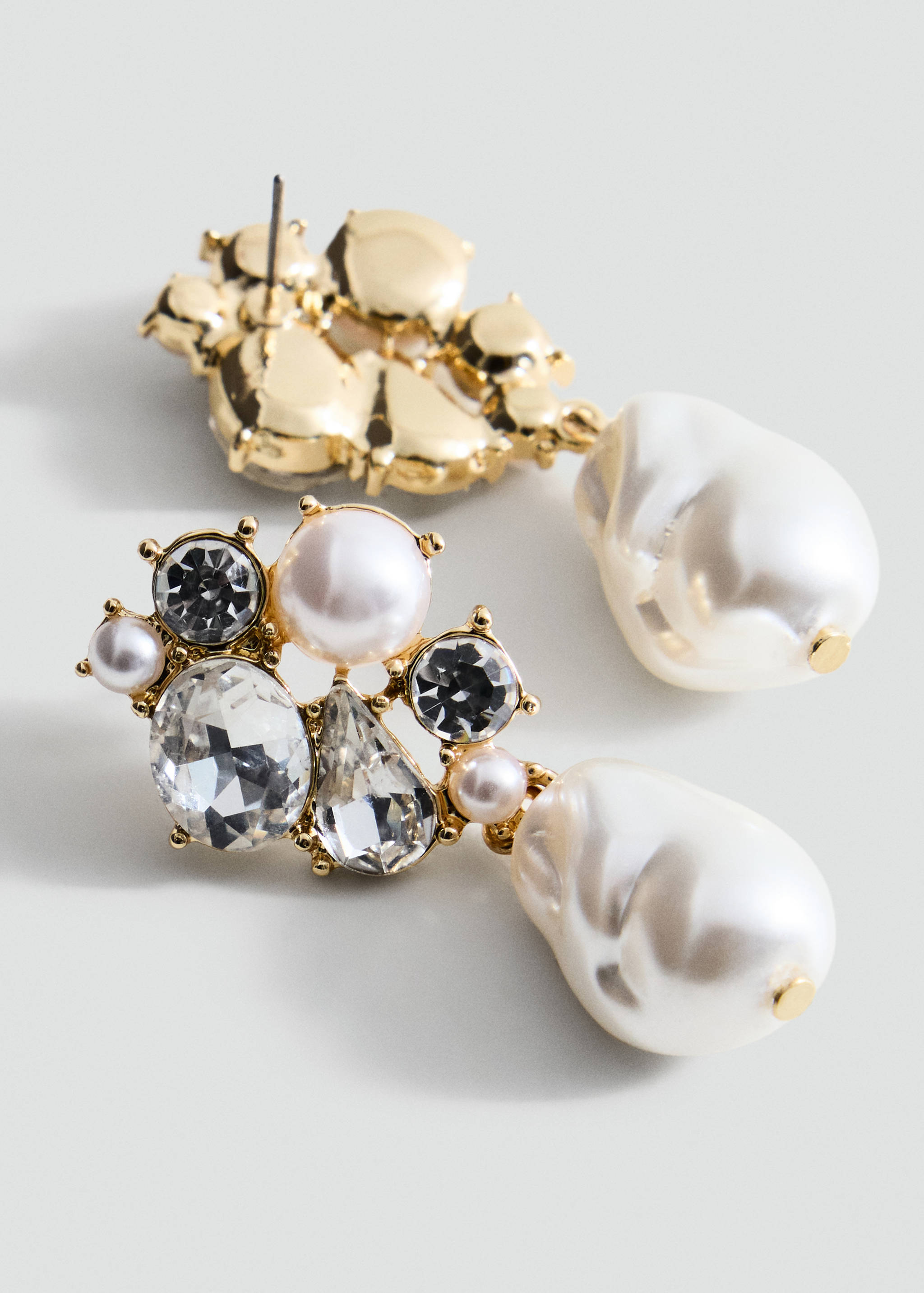 Gold-tone cluster earrings with crystals, small pearls, and large drop faux pearls.